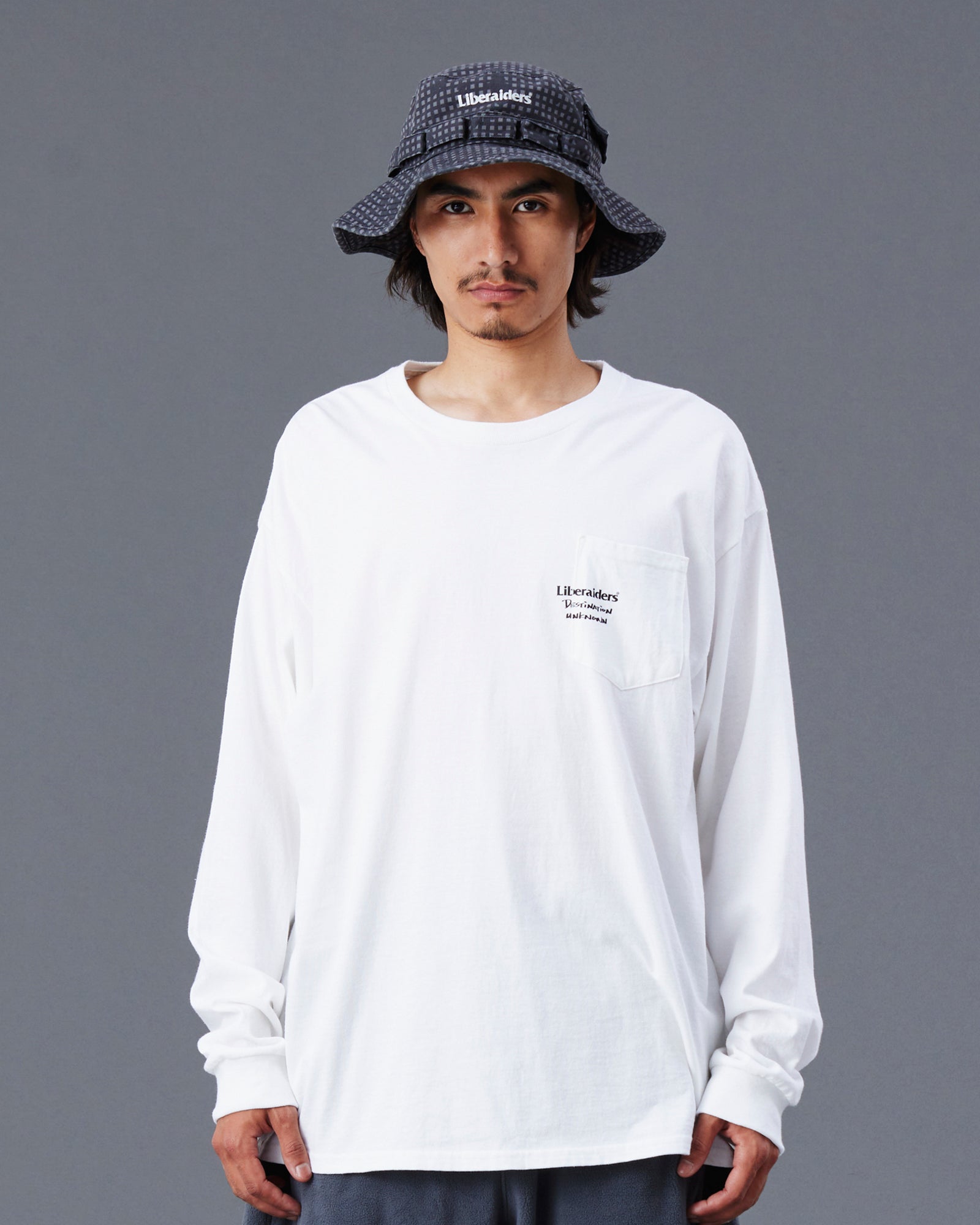 A Eckhaus Latta Shirt pictured on a model in front of a white background. The title of the product is Eckhaus Latta Eclipse Turtleneck - Stone and the image was taken by 199A®.