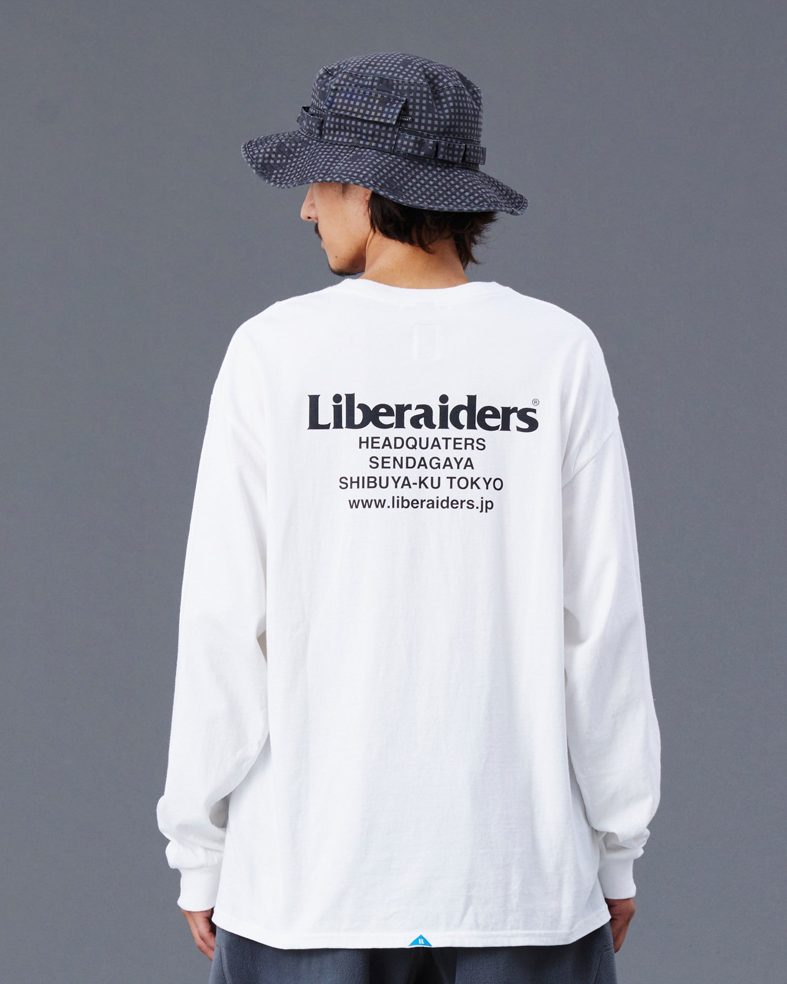 A Eckhaus Latta Shirt pictured on a model in front of a white background. The title of the product is Eckhaus Latta Eclipse Turtleneck - Stone and the image was taken by 199A®.