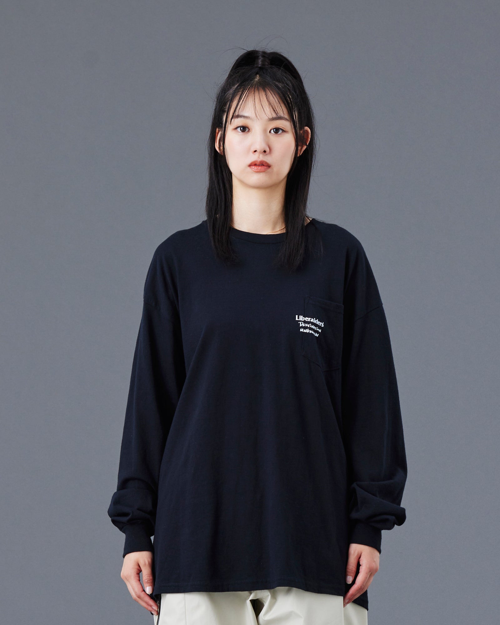 A Eckhaus Latta Shirt pictured on a model in front of a white background. The title of the product is Eckhaus Latta Eclipse Turtleneck - Stone and the image was taken by 199A®.