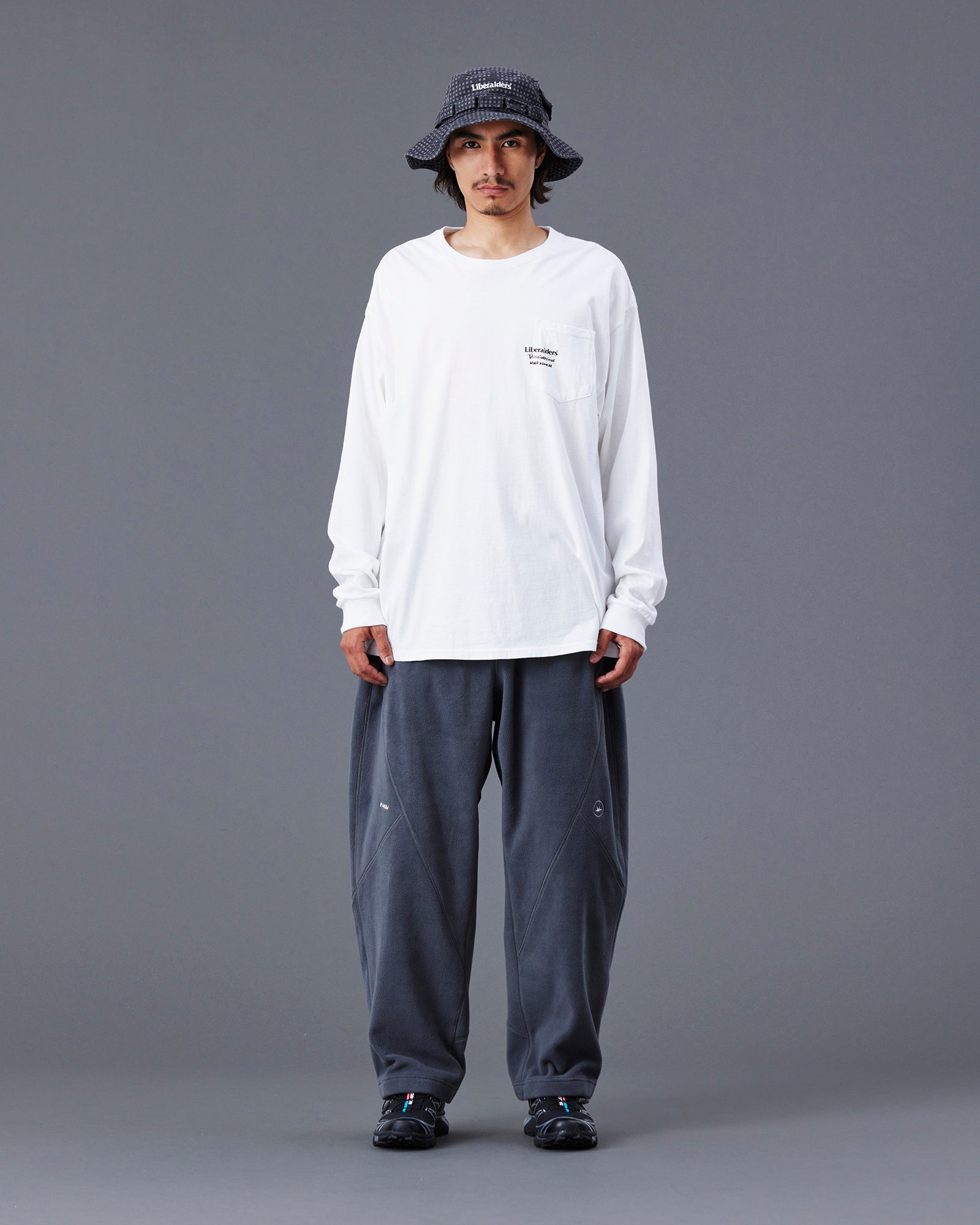 A Eckhaus Latta Shirt pictured on a model in front of a white background. The title of the product is Eckhaus Latta Eclipse Turtleneck - Stone and the image was taken by 199A®.