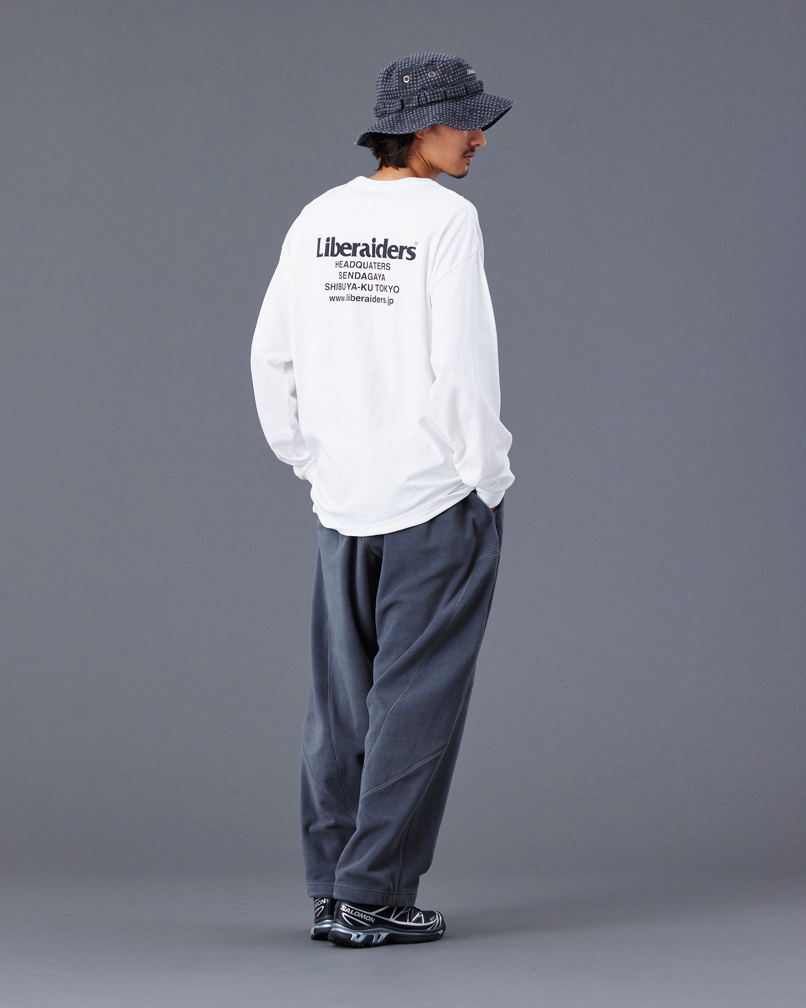 A Eckhaus Latta Shirt pictured on a model in front of a white background. The title of the product is Eckhaus Latta Eclipse Turtleneck - Stone and the image was taken by 199A®.