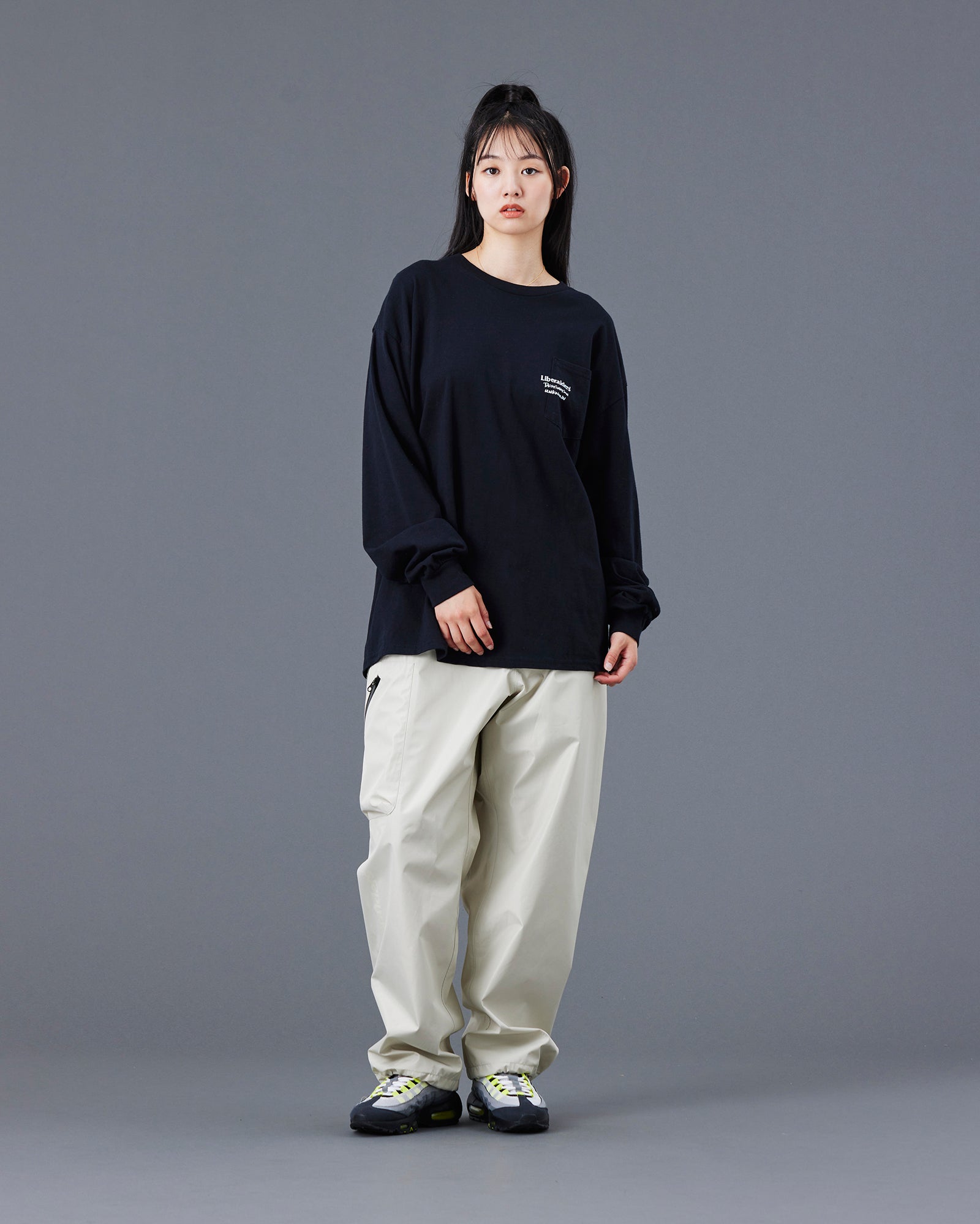 A Eckhaus Latta Shirt pictured on a model in front of a white background. The title of the product is Eckhaus Latta Eclipse Turtleneck - Stone and the image was taken by 199A®.