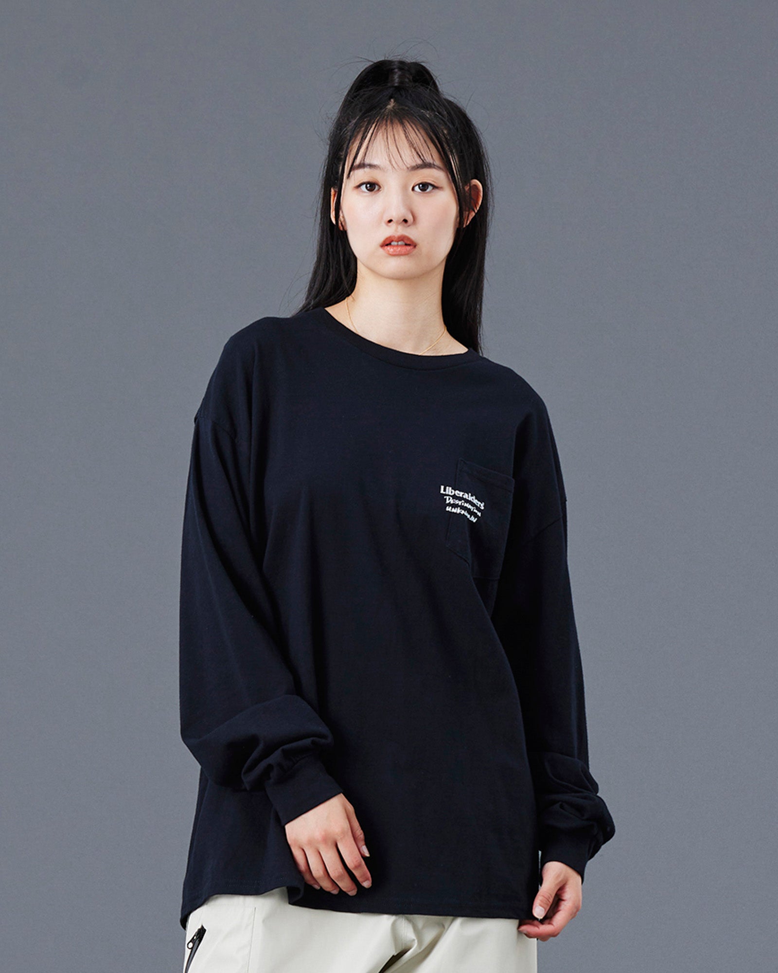 A Eckhaus Latta Shirt pictured on a model in front of a white background. The title of the product is Eckhaus Latta Eclipse Turtleneck - Stone and the image was taken by 199A®.