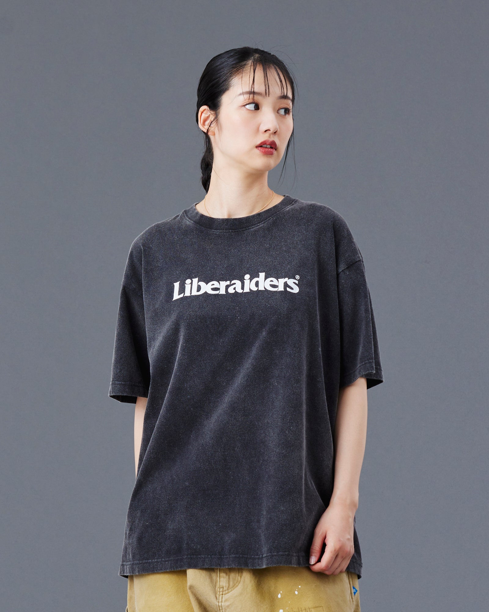 A Eckhaus Latta Shirt pictured on a model in front of a white background. The title of the product is Eckhaus Latta Eclipse Turtleneck - Stone and the image was taken by 199A®.