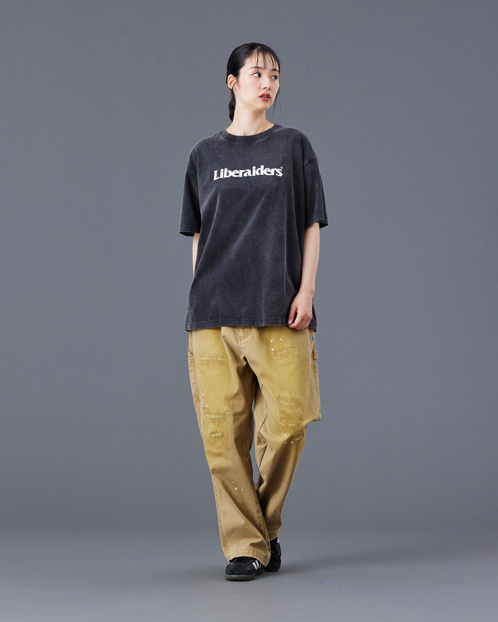 A Eckhaus Latta Shirt pictured on a model in front of a white background. The title of the product is Eckhaus Latta Eclipse Turtleneck - Stone and the image was taken by 199A®.