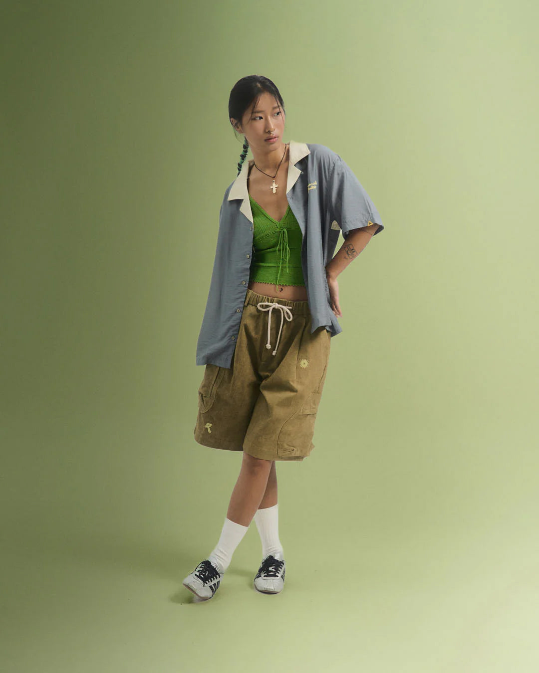 A Eckhaus Latta Shirt pictured on a model in front of a white background. The title of the product is Eckhaus Latta Eclipse Turtleneck - Stone and the image was taken by 199A®.