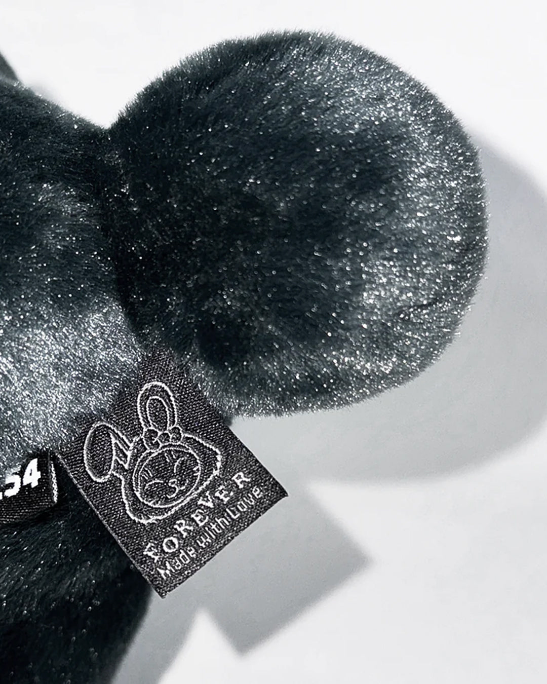 A Eckhaus Latta Shirt pictured on a model in front of a white background. The title of the product is Eckhaus Latta Eclipse Turtleneck - Stone and the image was taken by 199A®.