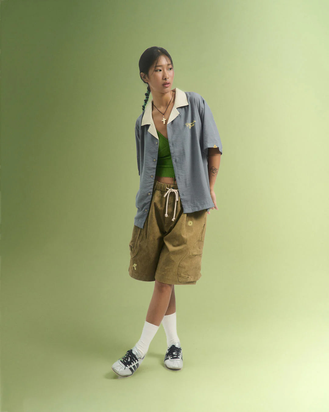 A Eckhaus Latta Shirt pictured on a model in front of a white background. The title of the product is Eckhaus Latta Eclipse Turtleneck - Stone and the image was taken by 199A®.
