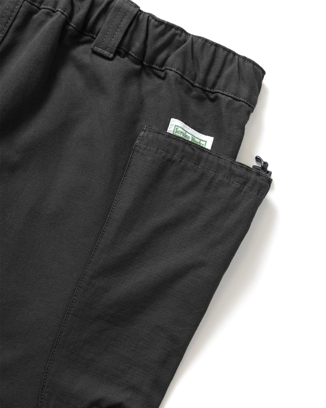 A Eckhaus Latta Shirt pictured on a model in front of a white background. The title of the product is Eckhaus Latta Eclipse Turtleneck - Stone and the image was taken by 199A®.