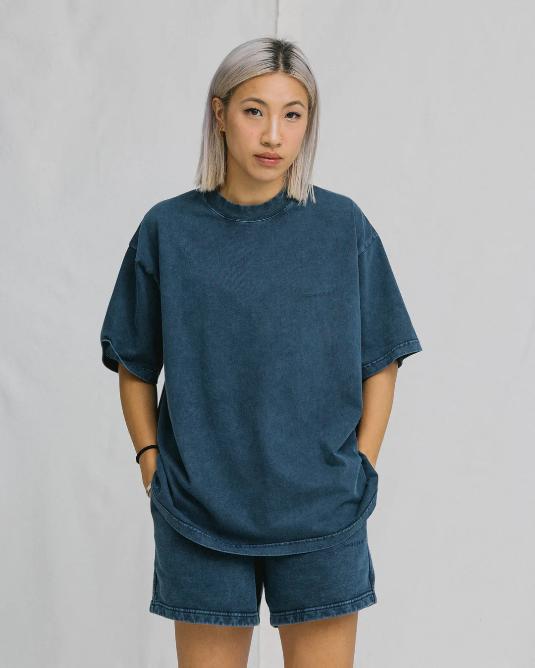 A Eckhaus Latta Shirt pictured on a model in front of a white background. The title of the product is Eckhaus Latta Eclipse Turtleneck - Stone and the image was taken by 199A®.