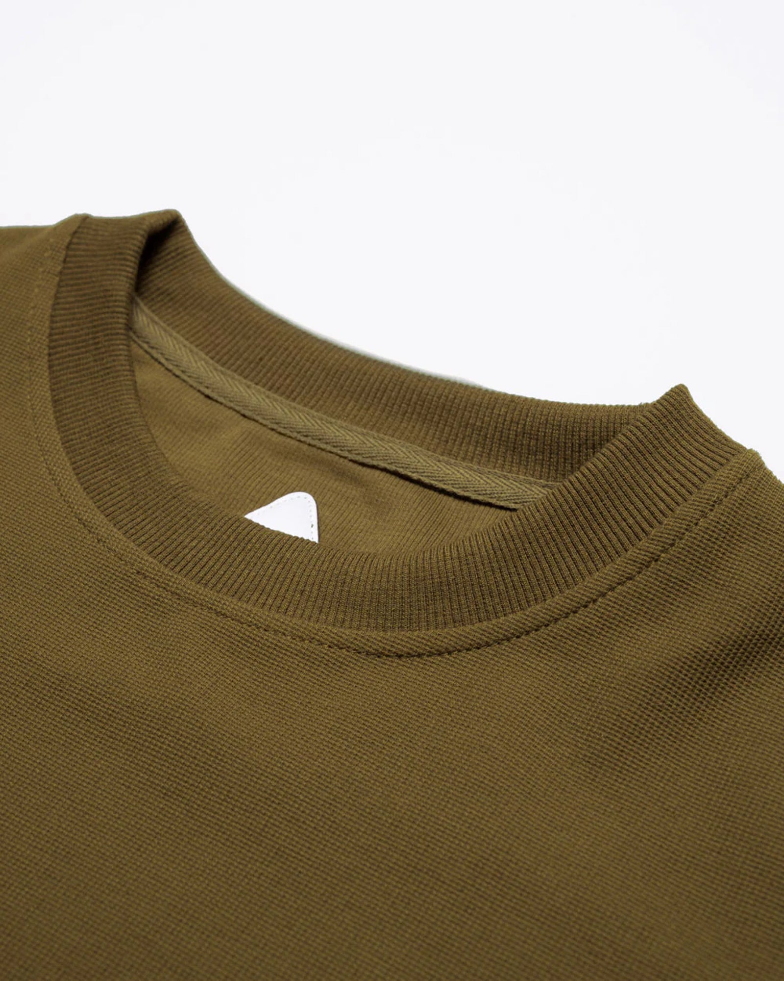 A Eckhaus Latta Shirt pictured on a model in front of a white background. The title of the product is Eckhaus Latta Eclipse Turtleneck - Stone and the image was taken by 199A®.