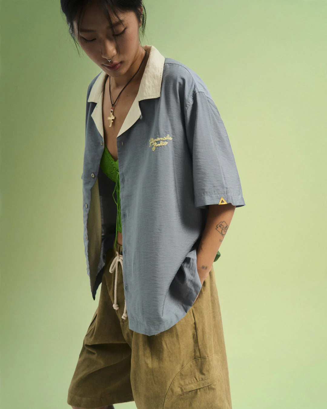 A Eckhaus Latta Shirt pictured on a model in front of a white background. The title of the product is Eckhaus Latta Eclipse Turtleneck - Stone and the image was taken by 199A®.