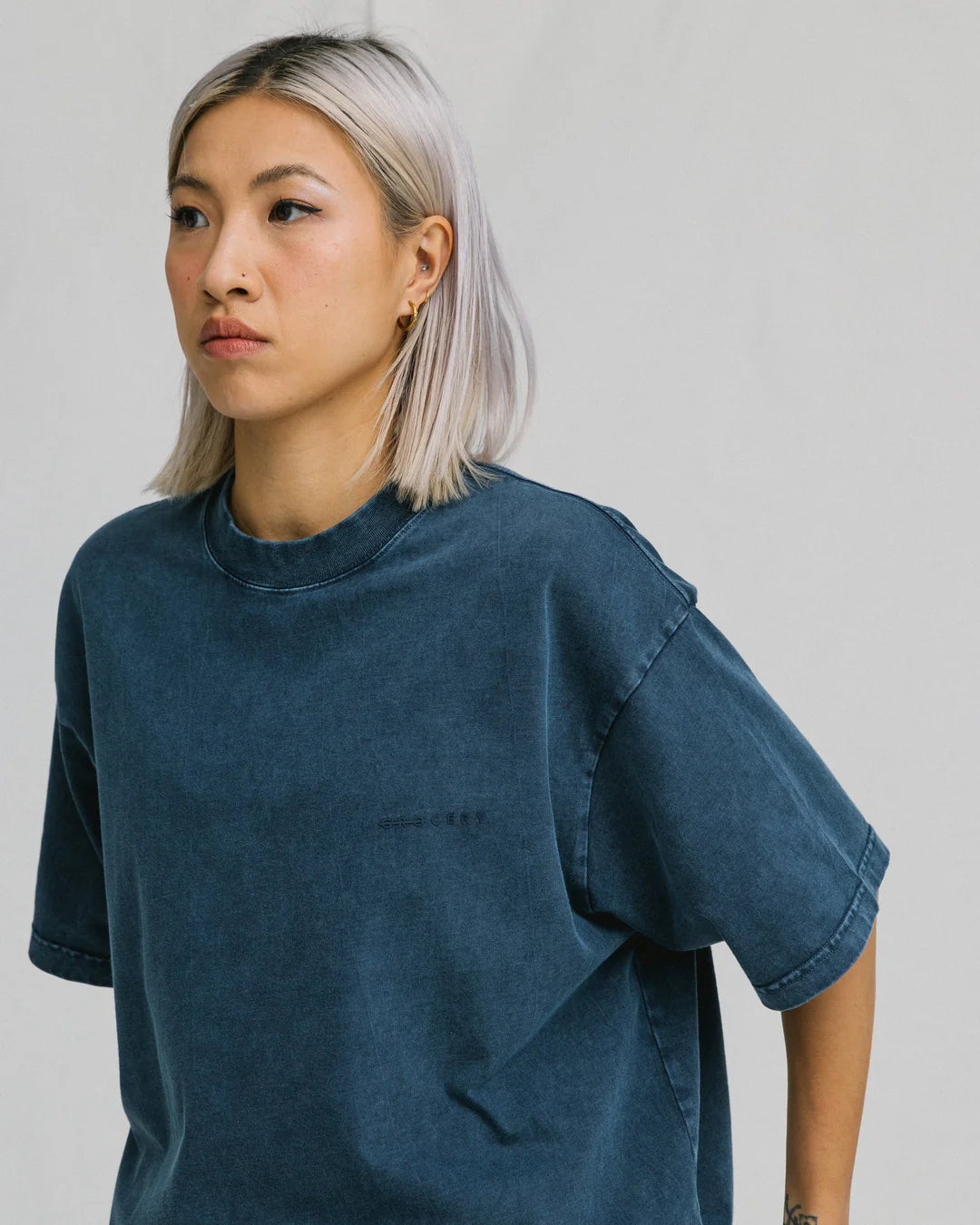 A Eckhaus Latta Shirt pictured on a model in front of a white background. The title of the product is Eckhaus Latta Eclipse Turtleneck - Stone and the image was taken by 199A®.