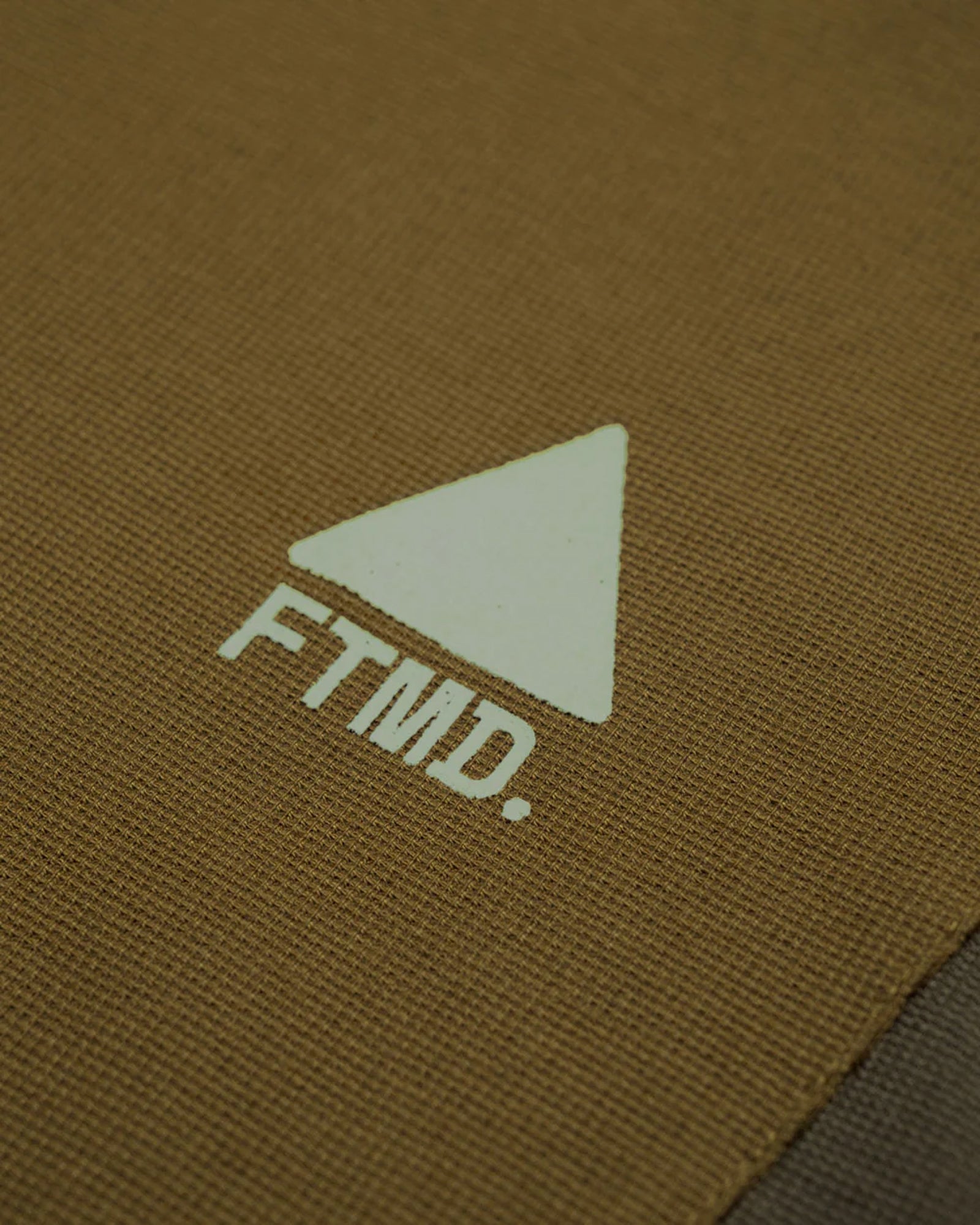 A Eckhaus Latta Shirt pictured on a model in front of a white background. The title of the product is Eckhaus Latta Eclipse Turtleneck - Stone and the image was taken by 199A®.