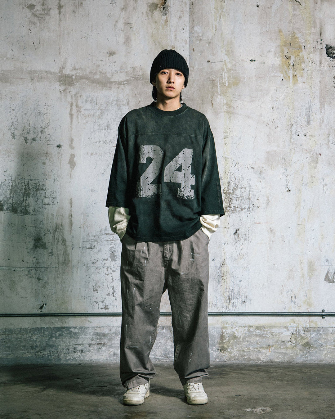 A Eckhaus Latta Shirt pictured on a model in front of a white background. The title of the product is Eckhaus Latta Eclipse Turtleneck - Stone and the image was taken by 199A®.
