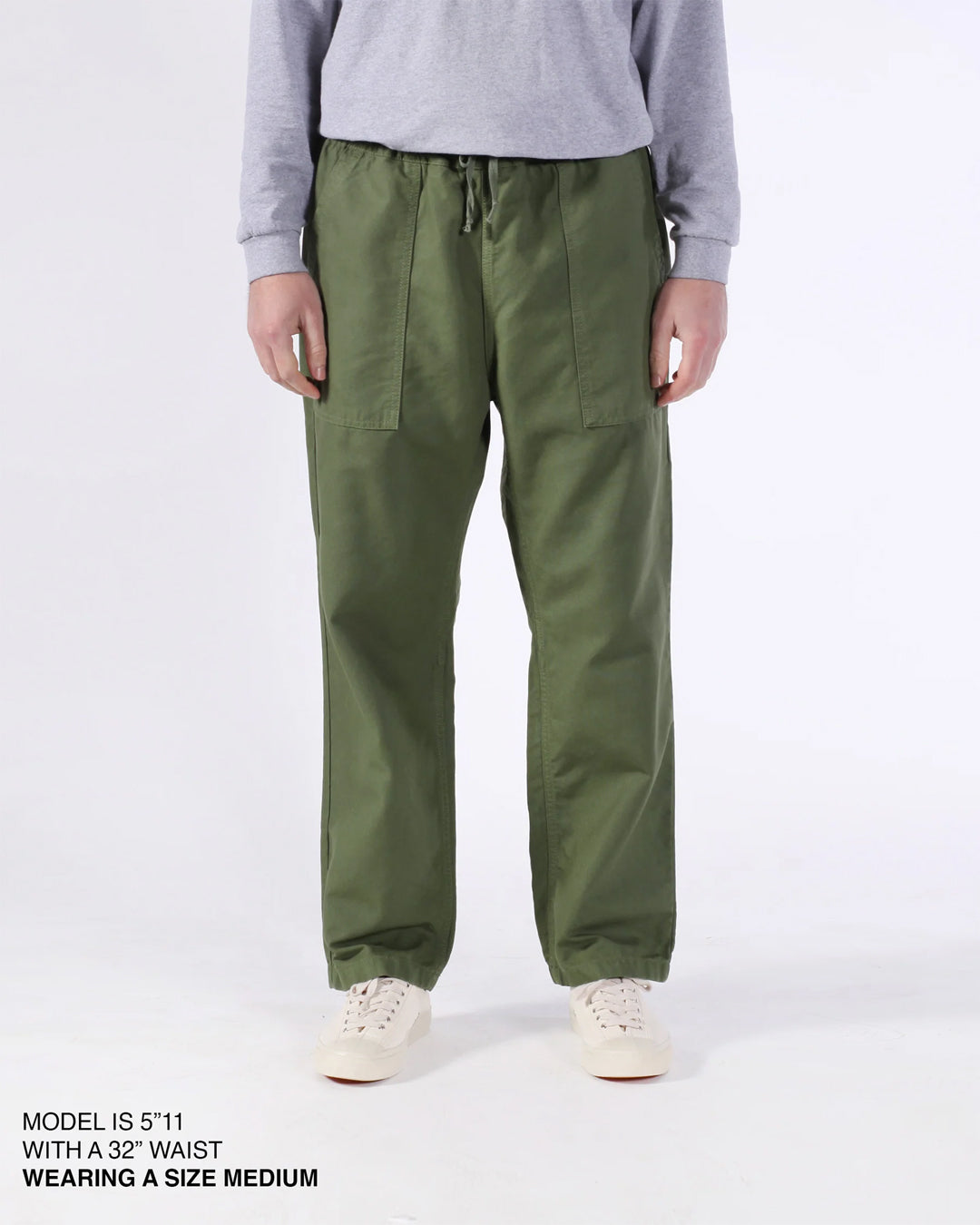A Eckhaus Latta Shirt pictured on a model in front of a white background. The title of the product is Eckhaus Latta Eclipse Turtleneck - Stone and the image was taken by 199A®.