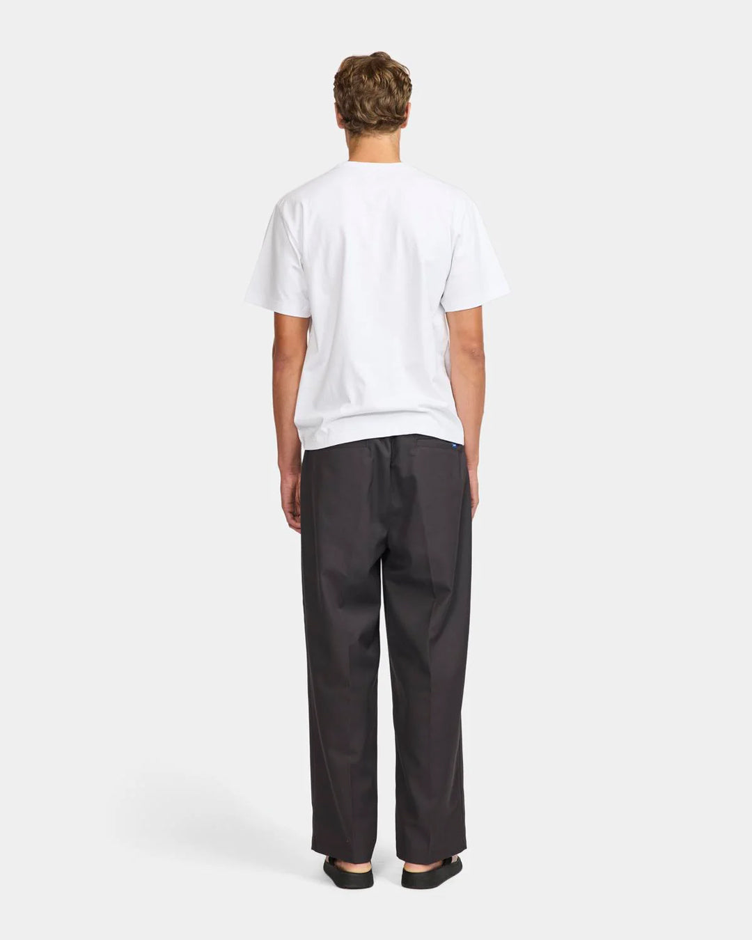 A Eckhaus Latta Shirt pictured on a model in front of a white background. The title of the product is Eckhaus Latta Eclipse Turtleneck - Stone and the image was taken by 199A®.