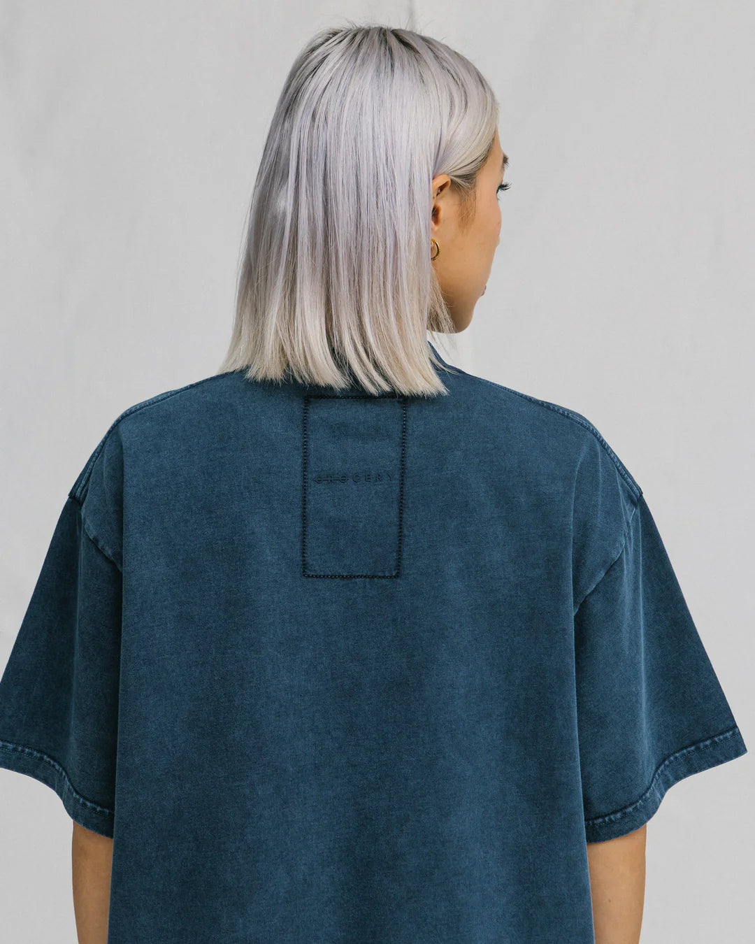 A Eckhaus Latta Shirt pictured on a model in front of a white background. The title of the product is Eckhaus Latta Eclipse Turtleneck - Stone and the image was taken by 199A®.