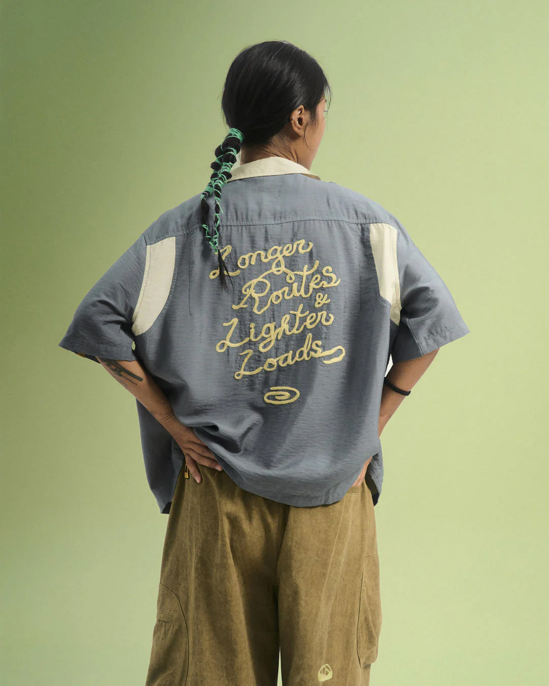 A Eckhaus Latta Shirt pictured on a model in front of a white background. The title of the product is Eckhaus Latta Eclipse Turtleneck - Stone and the image was taken by 199A®.