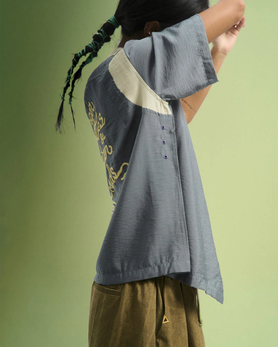 A Eckhaus Latta Shirt pictured on a model in front of a white background. The title of the product is Eckhaus Latta Eclipse Turtleneck - Stone and the image was taken by 199A®.