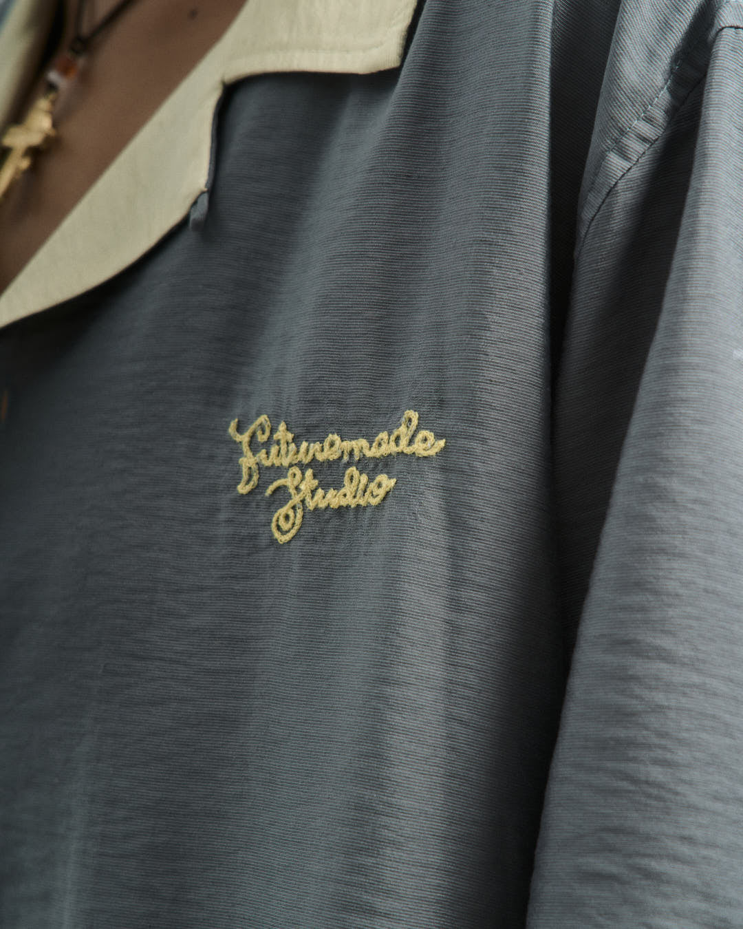 A Eckhaus Latta Shirt pictured on a model in front of a white background. The title of the product is Eckhaus Latta Eclipse Turtleneck - Stone and the image was taken by 199A®.