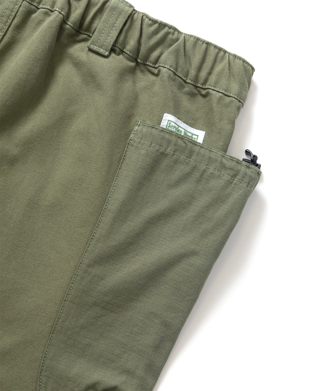 A Eckhaus Latta Shirt pictured on a model in front of a white background. The title of the product is Eckhaus Latta Eclipse Turtleneck - Stone and the image was taken by 199A®.