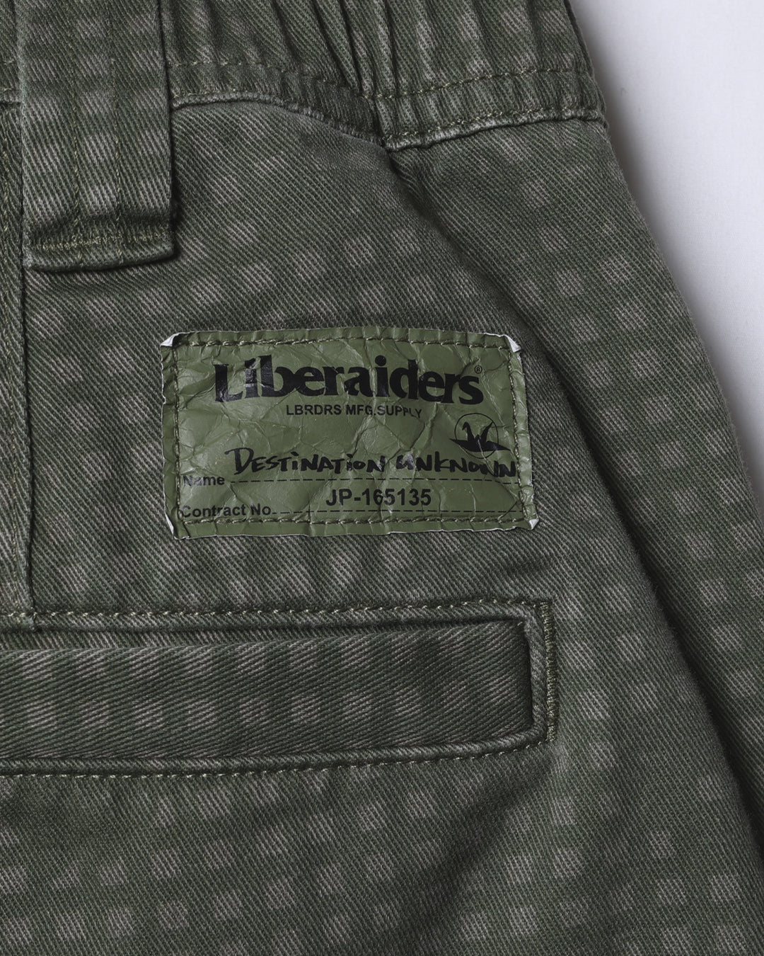 A Eckhaus Latta Shirt pictured on a model in front of a white background. The title of the product is Eckhaus Latta Eclipse Turtleneck - Stone and the image was taken by 199A®.