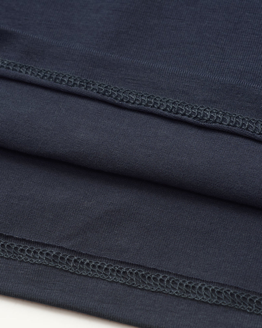 A Eckhaus Latta Shirt pictured on a model in front of a white background. The title of the product is Eckhaus Latta Eclipse Turtleneck - Stone and the image was taken by 199A®.