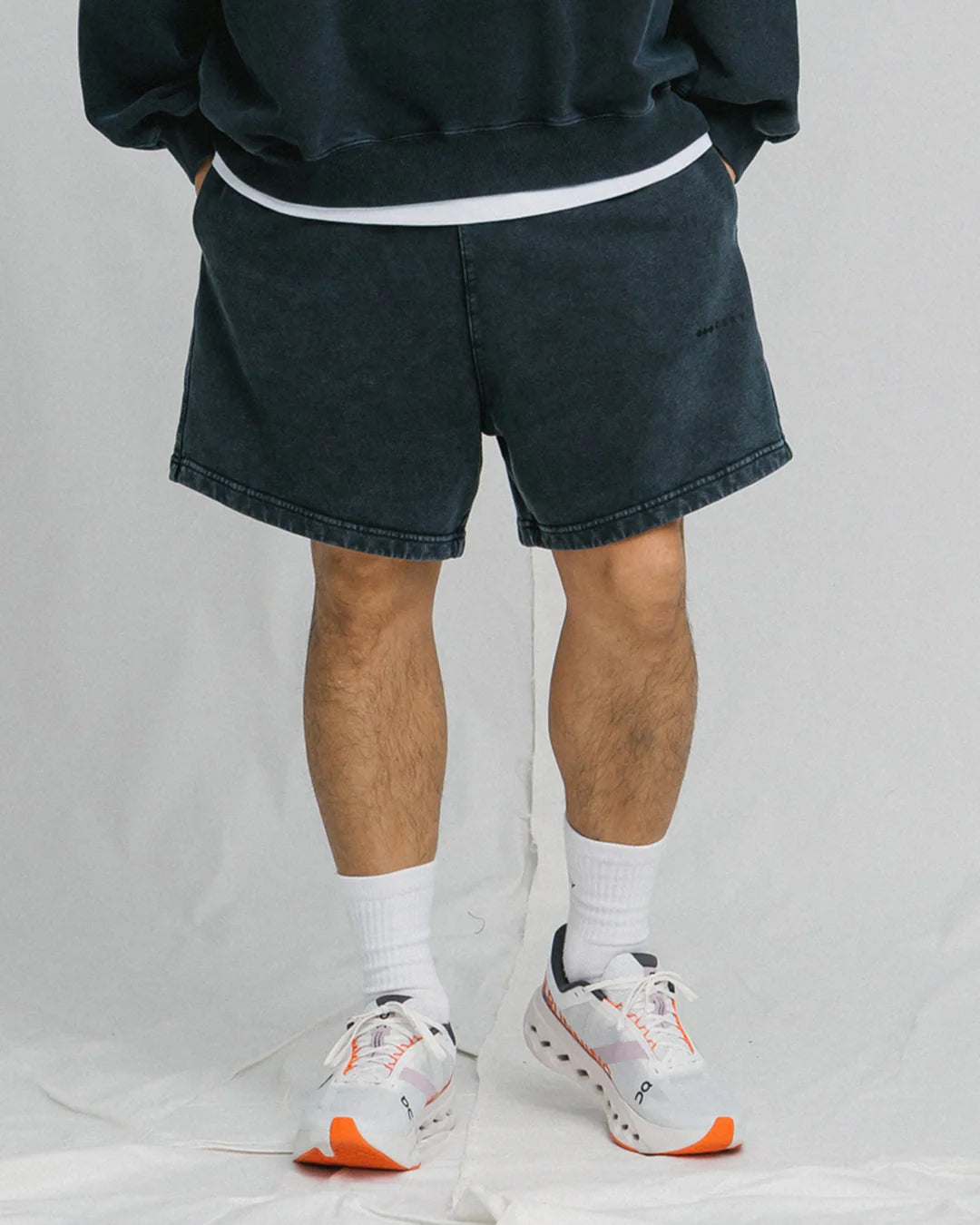 A Eckhaus Latta Shirt pictured on a model in front of a white background. The title of the product is Eckhaus Latta Eclipse Turtleneck - Stone and the image was taken by 199A®.