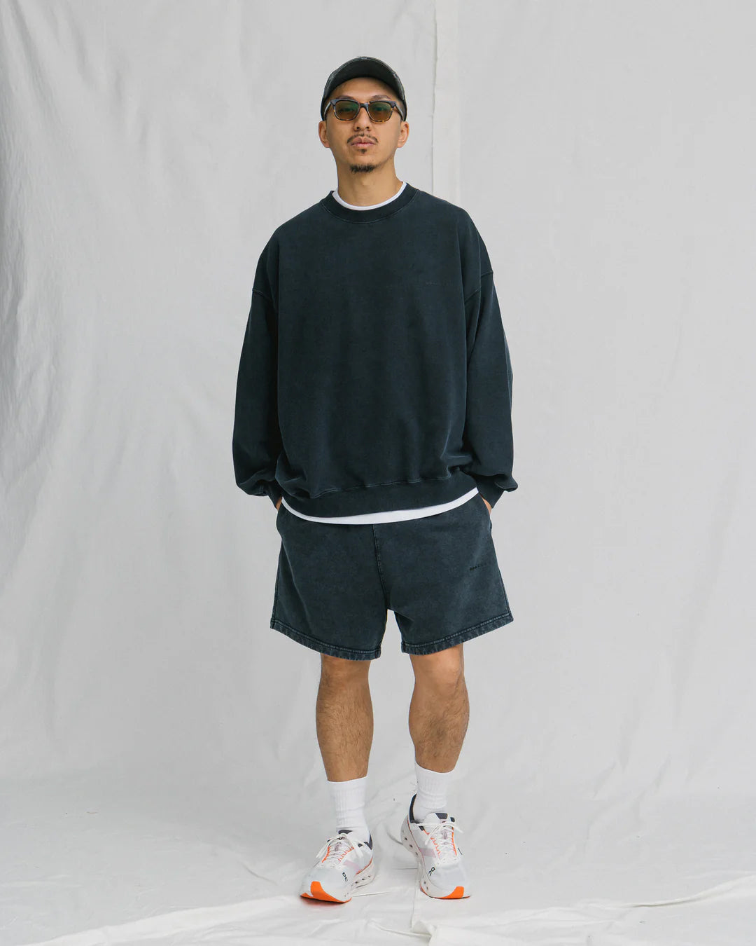 A Eckhaus Latta Shirt pictured on a model in front of a white background. The title of the product is Eckhaus Latta Eclipse Turtleneck - Stone and the image was taken by 199A®.