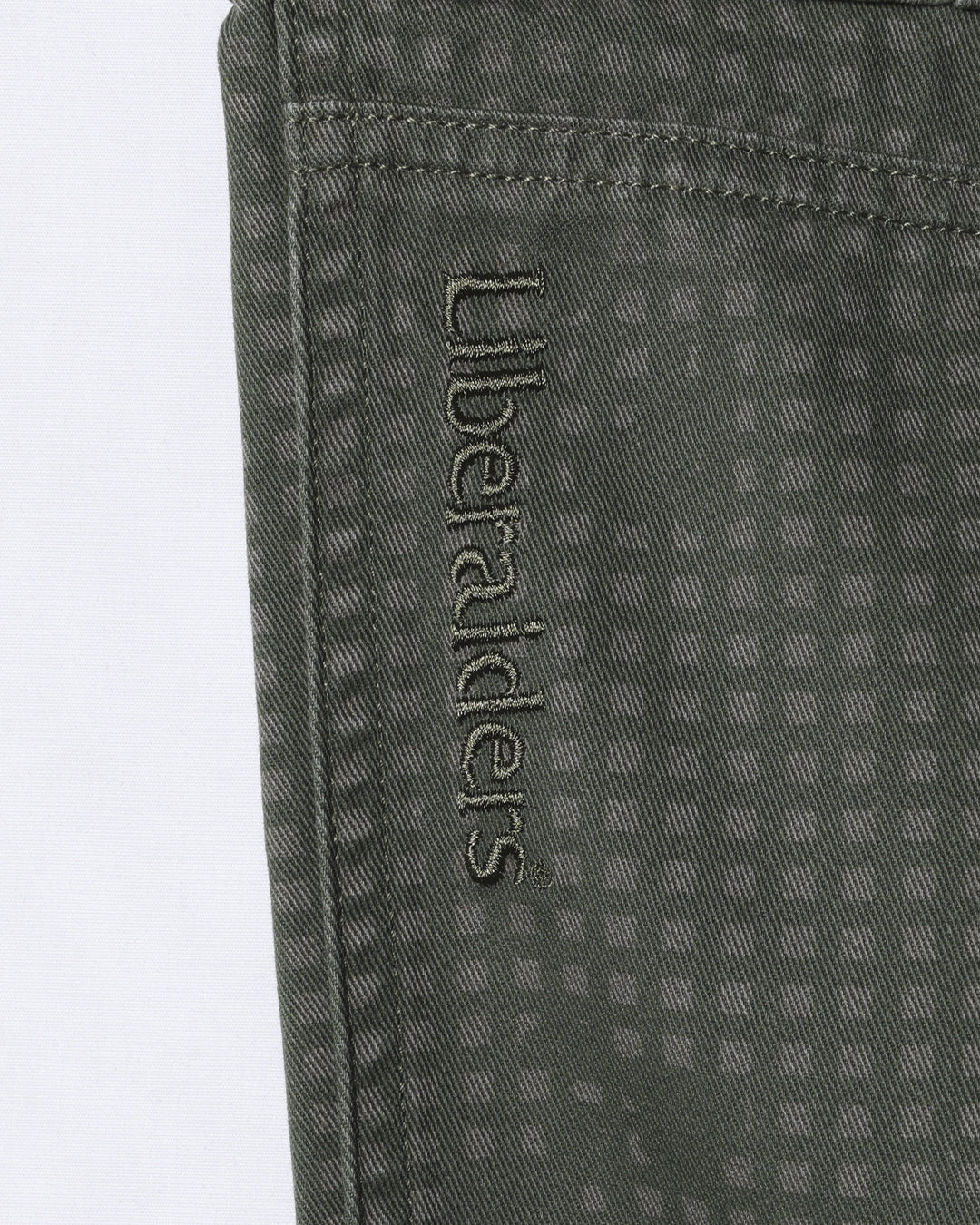 A Eckhaus Latta Shirt pictured on a model in front of a white background. The title of the product is Eckhaus Latta Eclipse Turtleneck - Stone and the image was taken by 199A®.