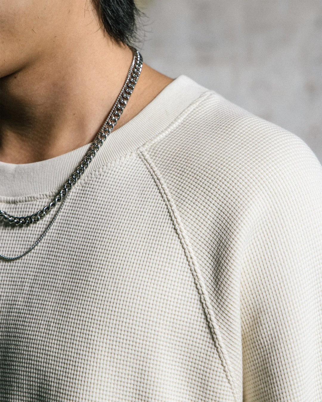 A Eckhaus Latta Shirt pictured on a model in front of a white background. The title of the product is Eckhaus Latta Eclipse Turtleneck - Stone and the image was taken by 199A®.