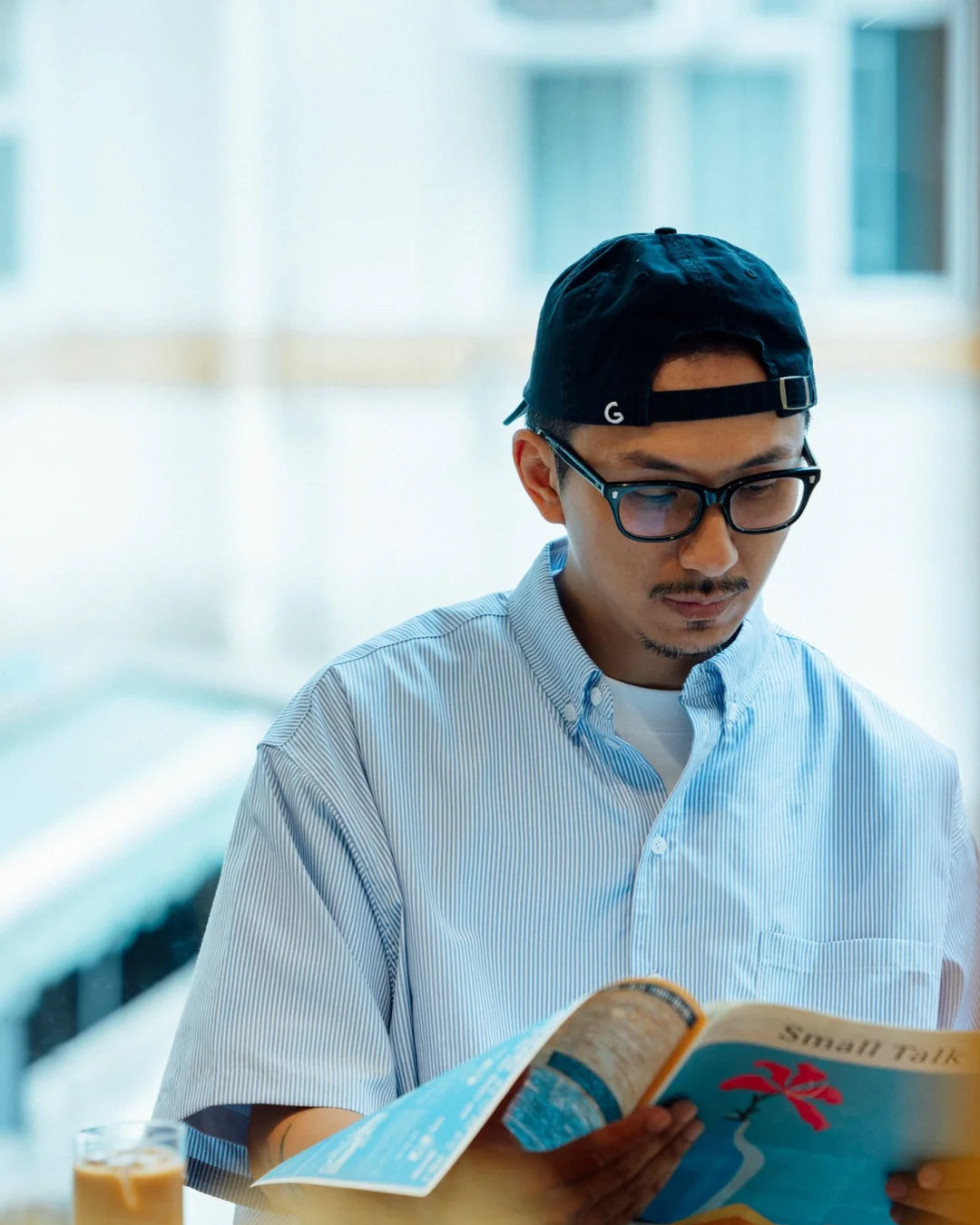 A Eckhaus Latta Shirt pictured on a model in front of a white background. The title of the product is Eckhaus Latta Eclipse Turtleneck - Stone and the image was taken by 199A®.