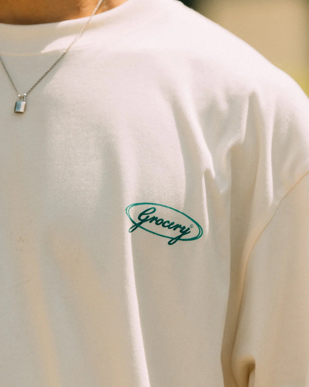 A Eckhaus Latta Shirt pictured on a model in front of a white background. The title of the product is Eckhaus Latta Eclipse Turtleneck - Stone and the image was taken by 199A®.