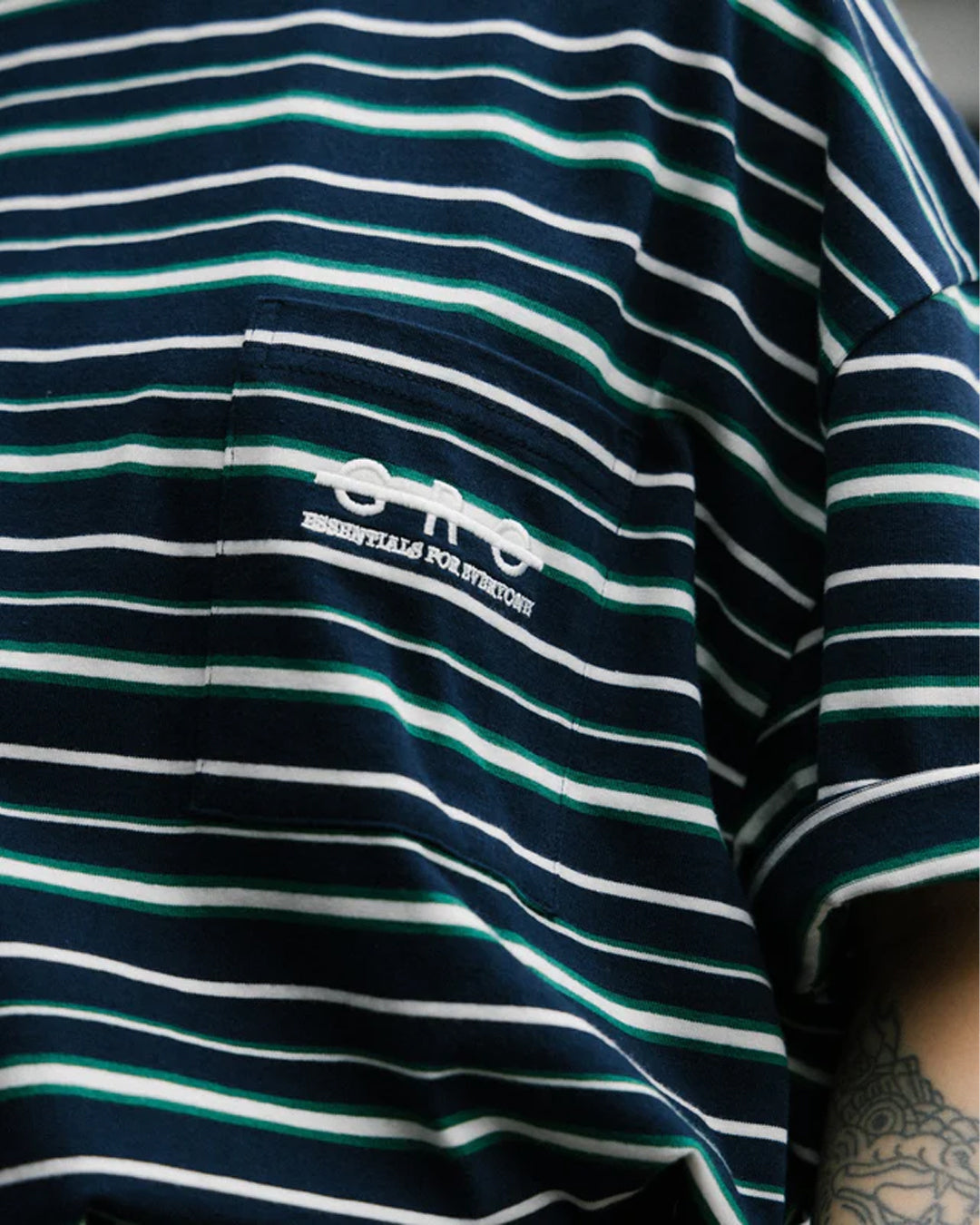 A Eckhaus Latta Shirt pictured on a model in front of a white background. The title of the product is Eckhaus Latta Eclipse Turtleneck - Stone and the image was taken by 199A®.