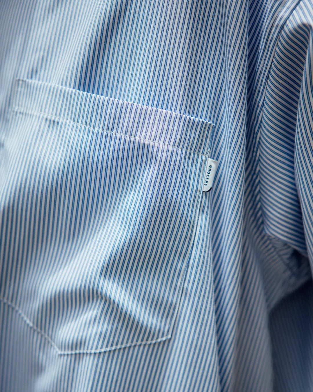 A Eckhaus Latta Shirt pictured on a model in front of a white background. The title of the product is Eckhaus Latta Eclipse Turtleneck - Stone and the image was taken by 199A®.