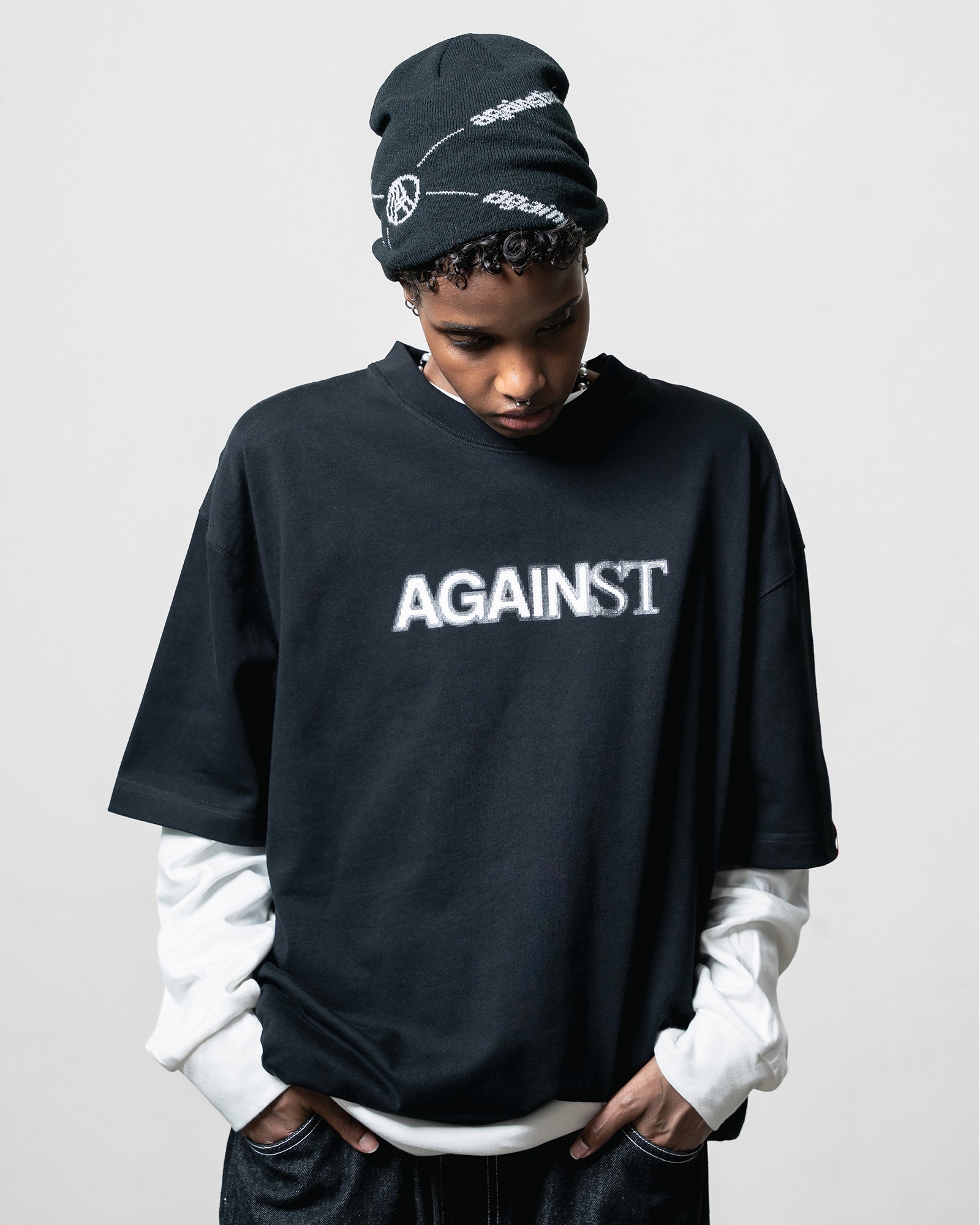 A Eckhaus Latta Shirt pictured on a model in front of a white background. The title of the product is Eckhaus Latta Eclipse Turtleneck - Stone and the image was taken by 199A®.