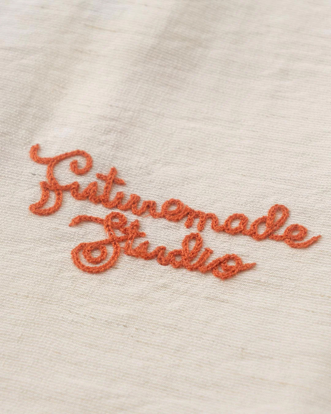 A Eckhaus Latta Shirt pictured on a model in front of a white background. The title of the product is Eckhaus Latta Eclipse Turtleneck - Stone and the image was taken by 199A®.