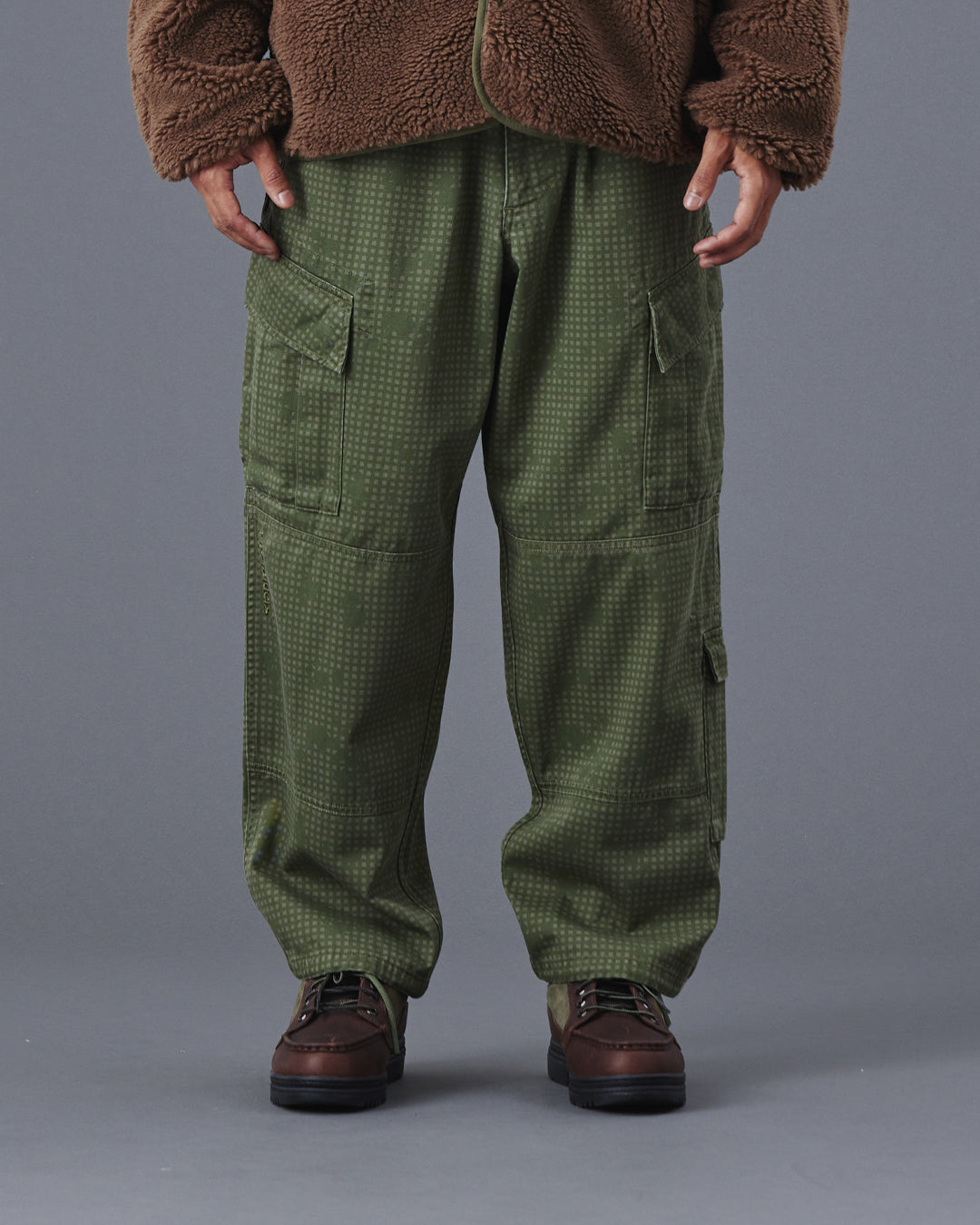 A Eckhaus Latta Shirt pictured on a model in front of a white background. The title of the product is Eckhaus Latta Eclipse Turtleneck - Stone and the image was taken by 199A®.