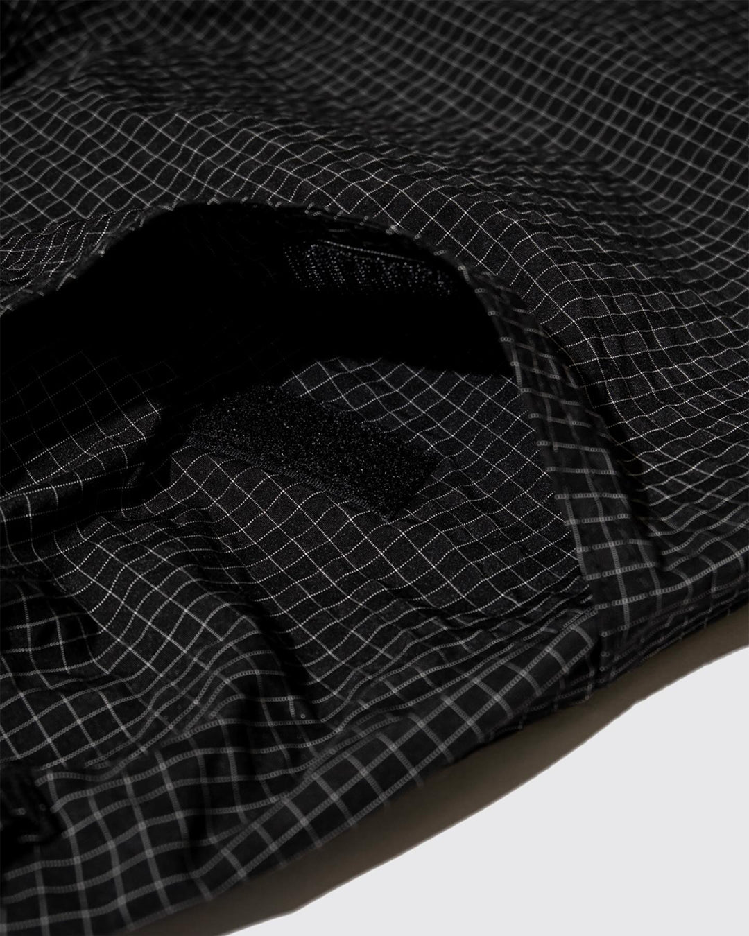 A Eckhaus Latta Shirt pictured on a model in front of a white background. The title of the product is Eckhaus Latta Eclipse Turtleneck - Stone and the image was taken by 199A®.