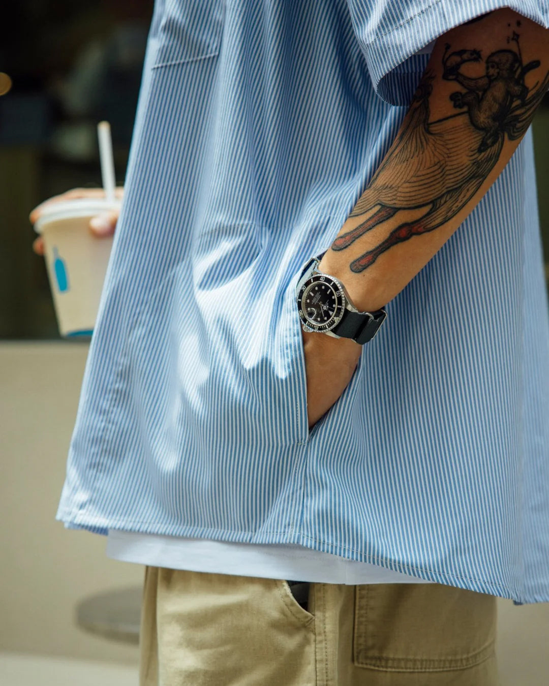 A Eckhaus Latta Shirt pictured on a model in front of a white background. The title of the product is Eckhaus Latta Eclipse Turtleneck - Stone and the image was taken by 199A®.