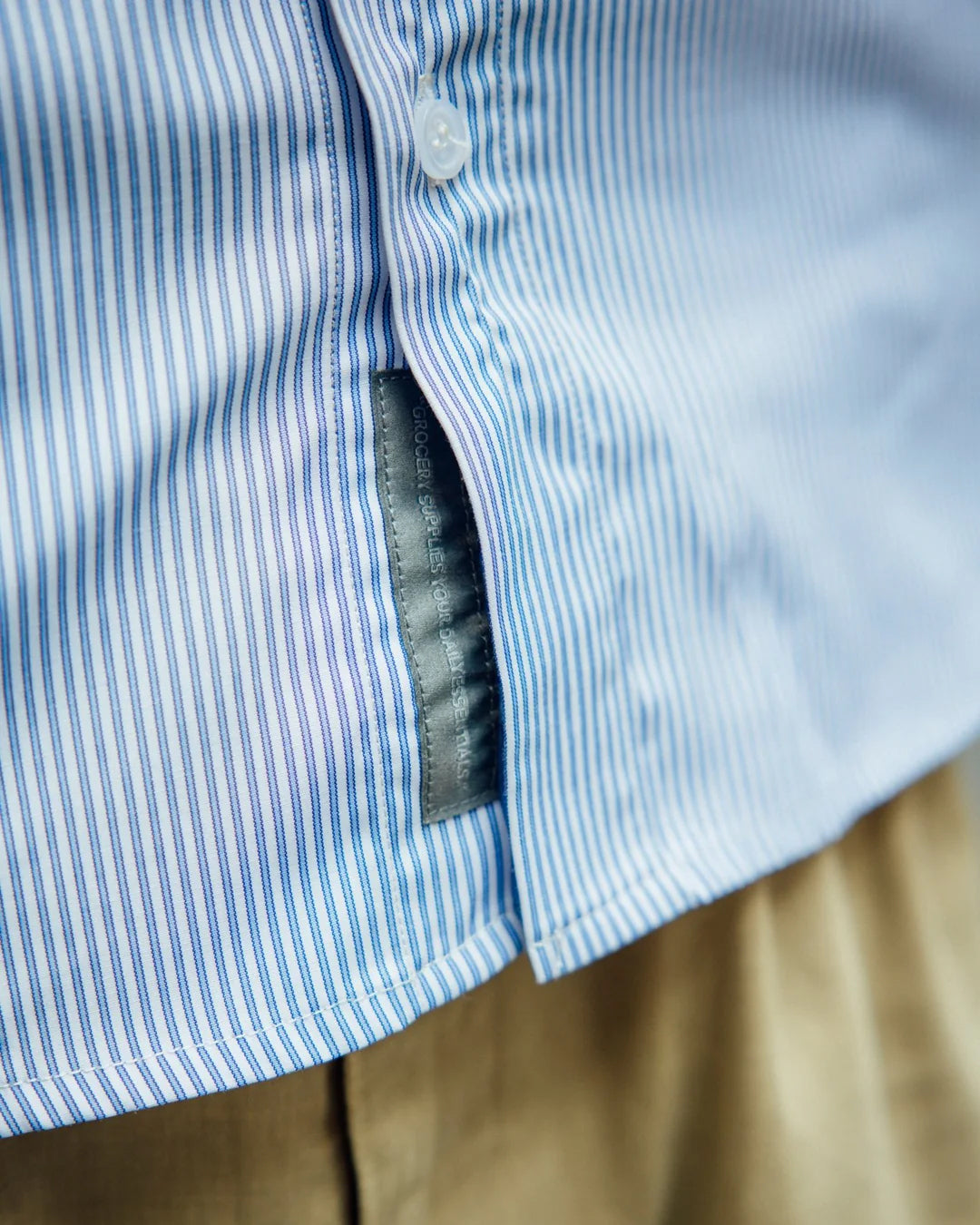 A Eckhaus Latta Shirt pictured on a model in front of a white background. The title of the product is Eckhaus Latta Eclipse Turtleneck - Stone and the image was taken by 199A®.