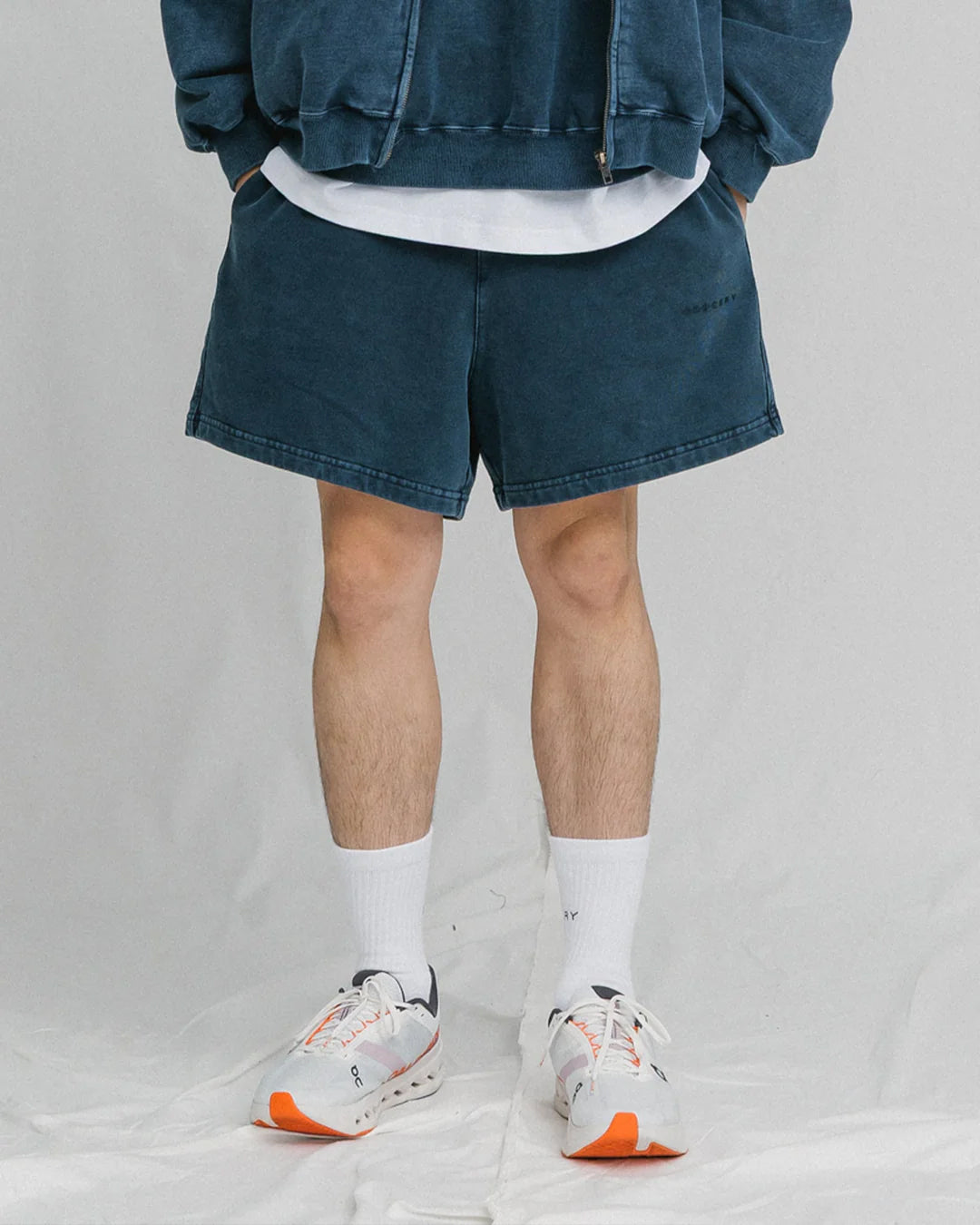 A Eckhaus Latta Shirt pictured on a model in front of a white background. The title of the product is Eckhaus Latta Eclipse Turtleneck - Stone and the image was taken by 199A®.