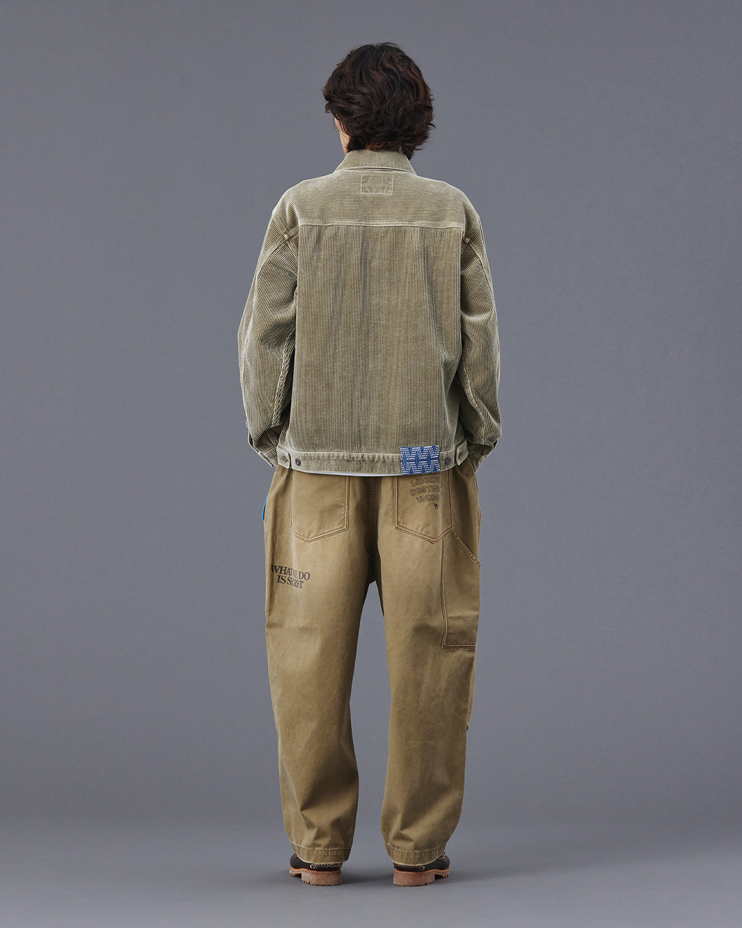 A Eckhaus Latta Shirt pictured on a model in front of a white background. The title of the product is Eckhaus Latta Eclipse Turtleneck - Stone and the image was taken by 199A®.
