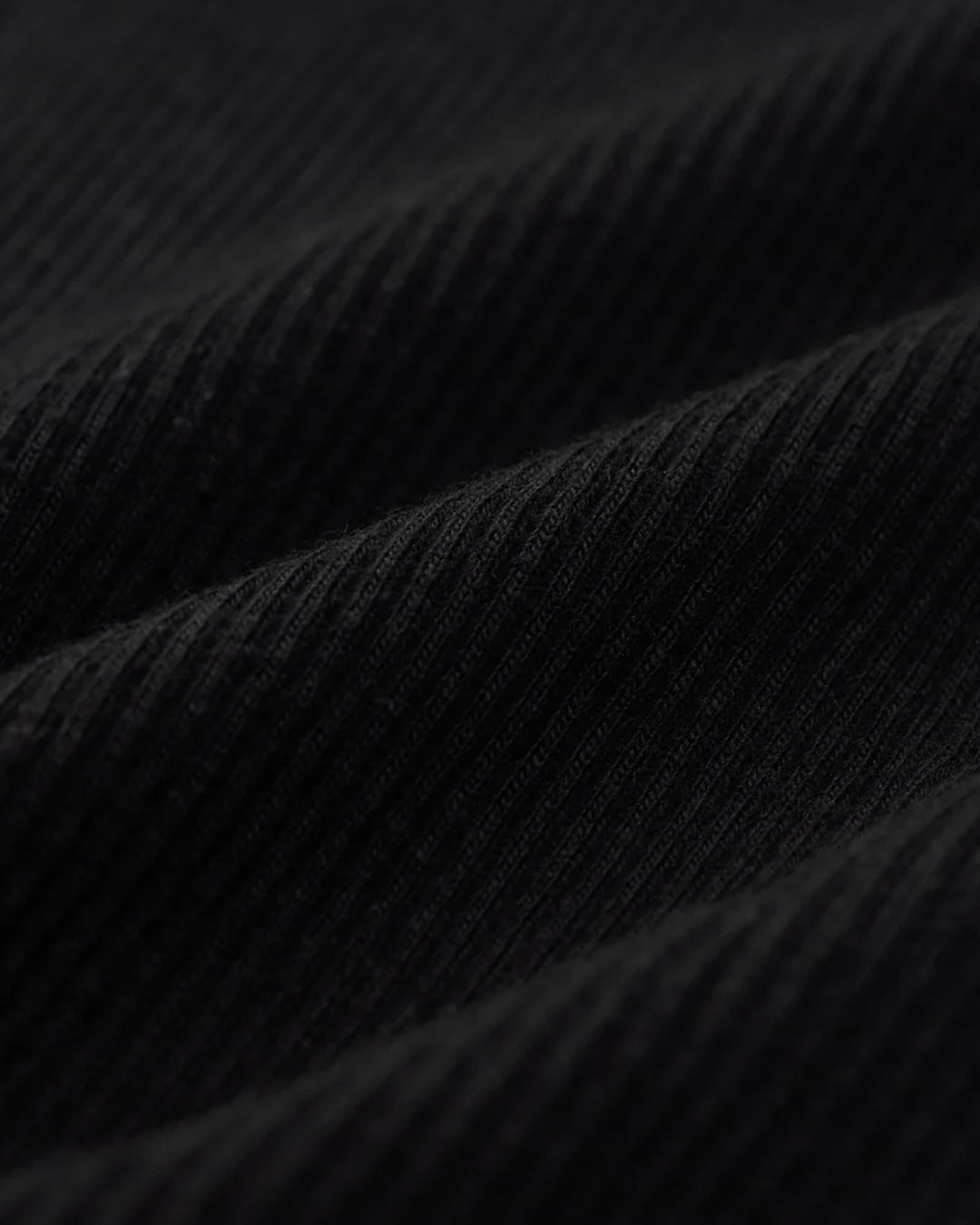 A Eckhaus Latta Shirt pictured on a model in front of a white background. The title of the product is Eckhaus Latta Eclipse Turtleneck - Stone and the image was taken by 199A®.