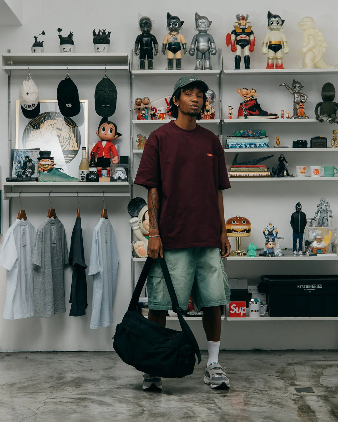 A Eckhaus Latta Shirt pictured on a model in front of a white background. The title of the product is Eckhaus Latta Eclipse Turtleneck - Stone and the image was taken by 199A®.