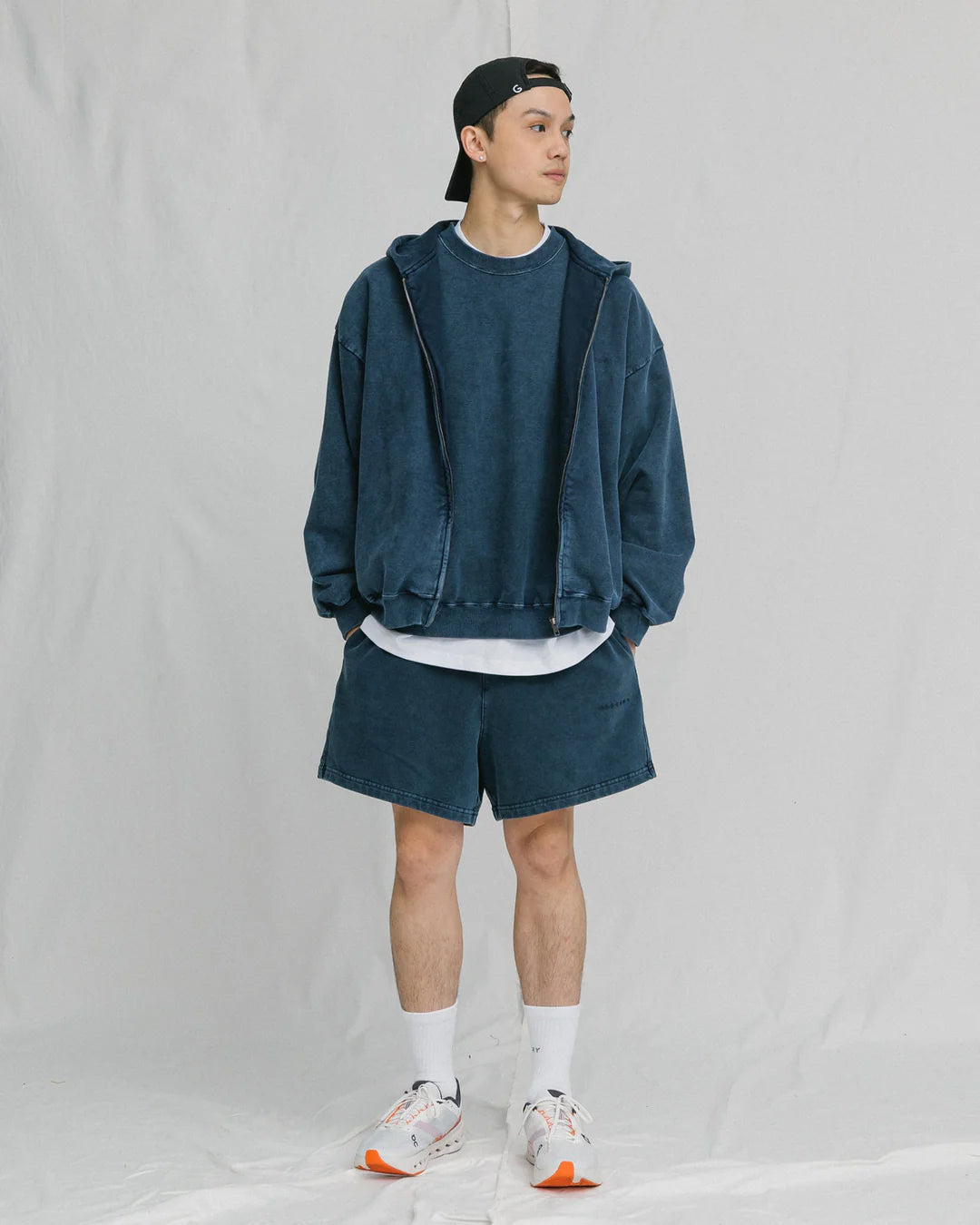 A Eckhaus Latta Shirt pictured on a model in front of a white background. The title of the product is Eckhaus Latta Eclipse Turtleneck - Stone and the image was taken by 199A®.