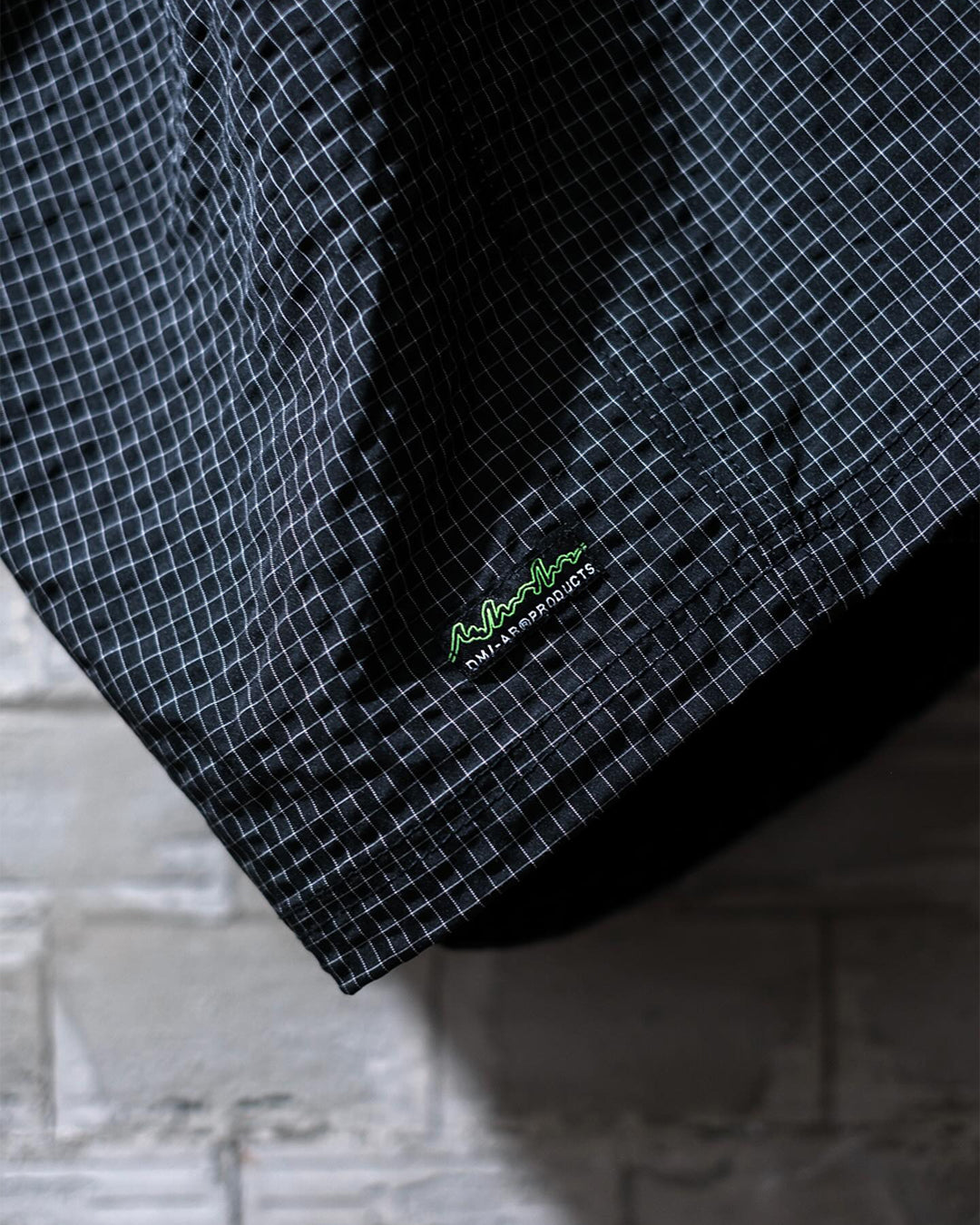 A Eckhaus Latta Shirt pictured on a model in front of a white background. The title of the product is Eckhaus Latta Eclipse Turtleneck - Stone and the image was taken by 199A®.