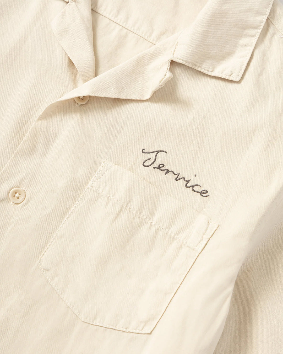 A Eckhaus Latta Shirt pictured on a model in front of a white background. The title of the product is Eckhaus Latta Eclipse Turtleneck - Stone and the image was taken by 199A®.