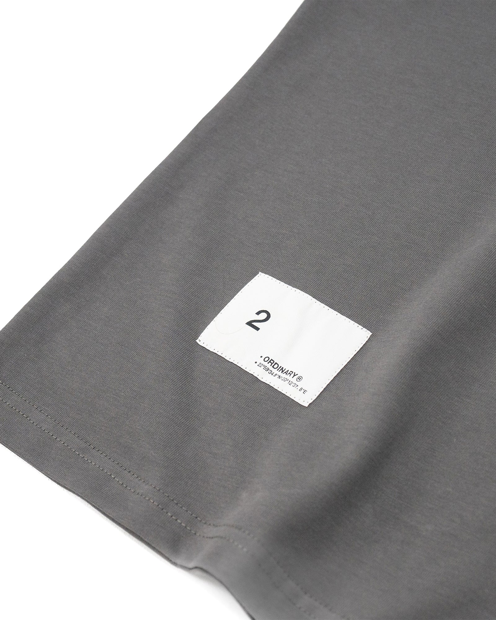 A Eckhaus Latta Shirt pictured on a model in front of a white background. The title of the product is Eckhaus Latta Eclipse Turtleneck - Stone and the image was taken by 199A®.